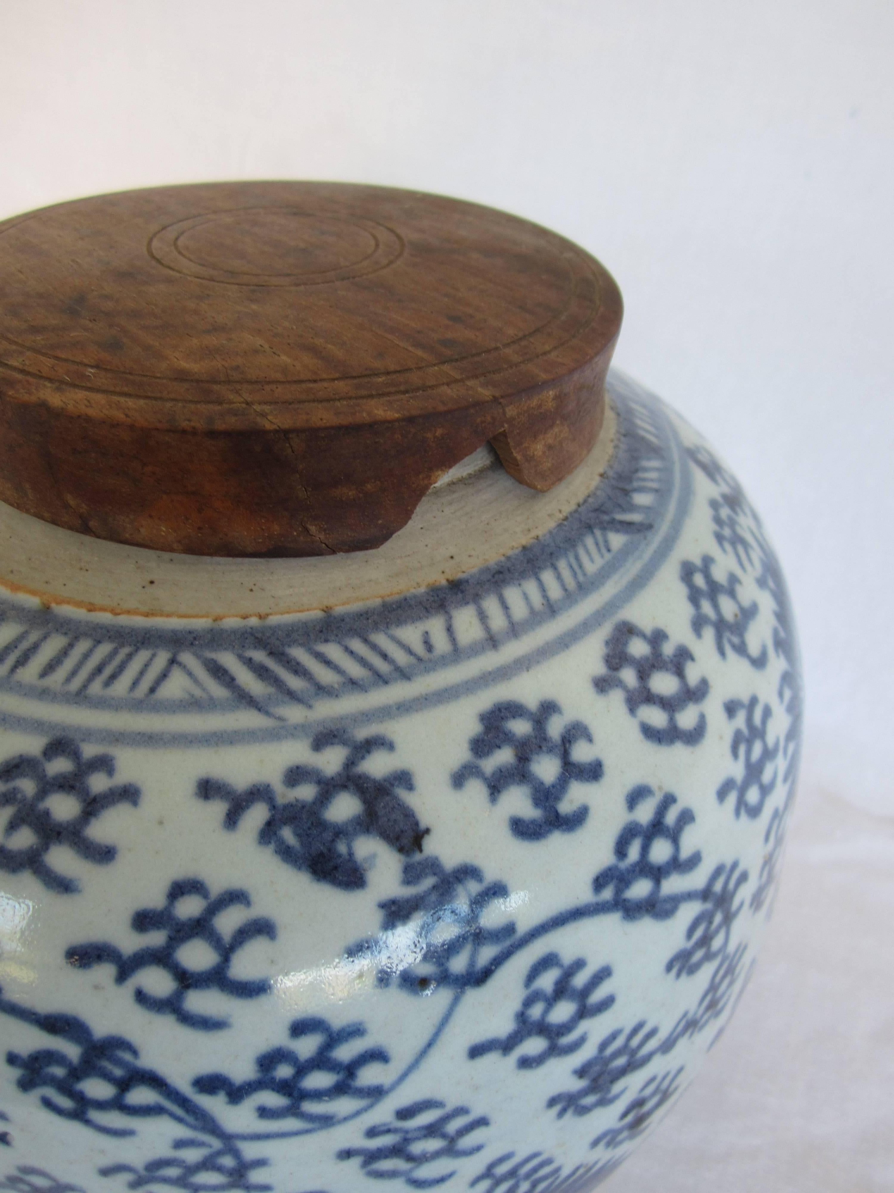 Chinese blue and white ginger jar with wooden lid.