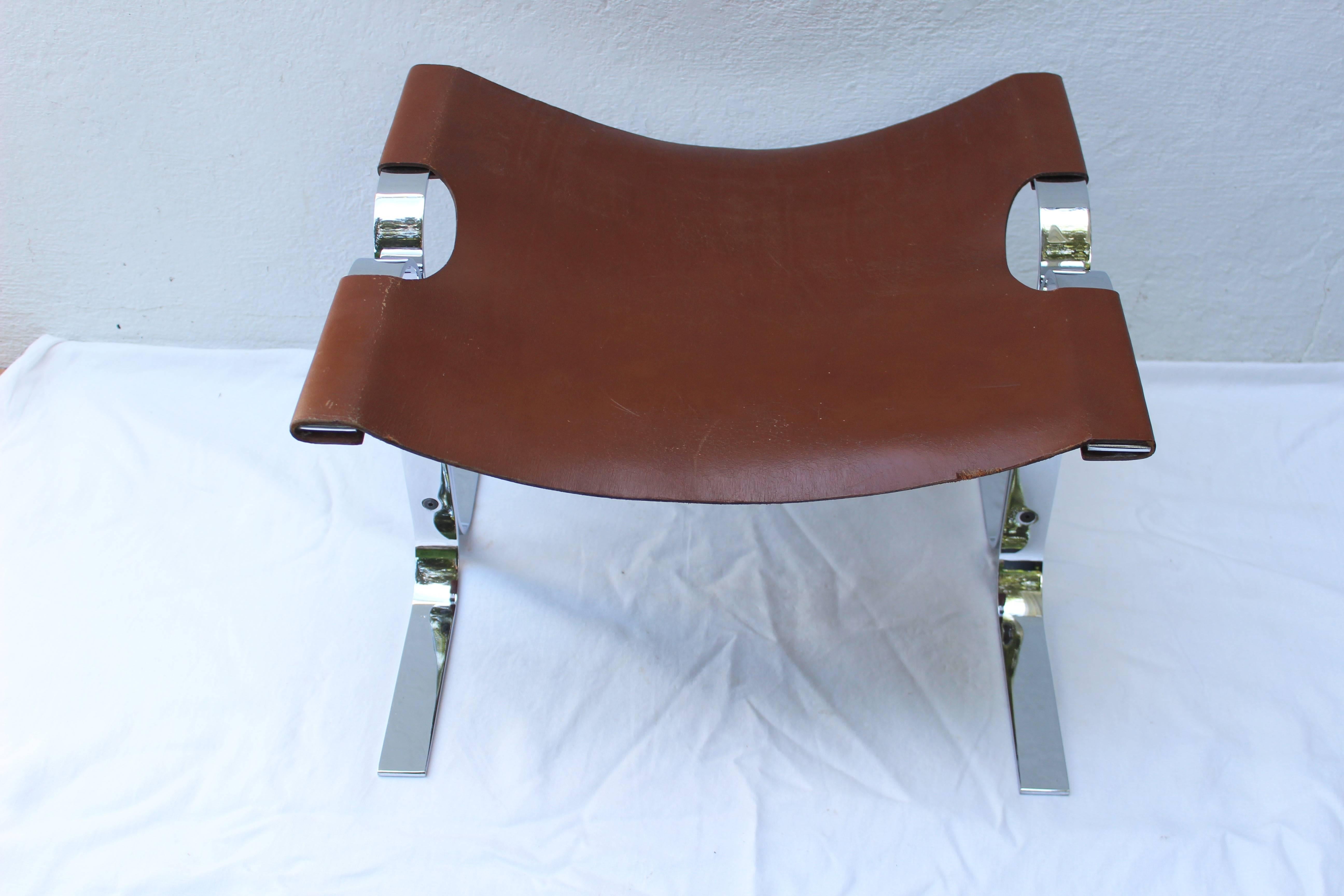 Great looking modern polished steel and leather sling stool or bench.