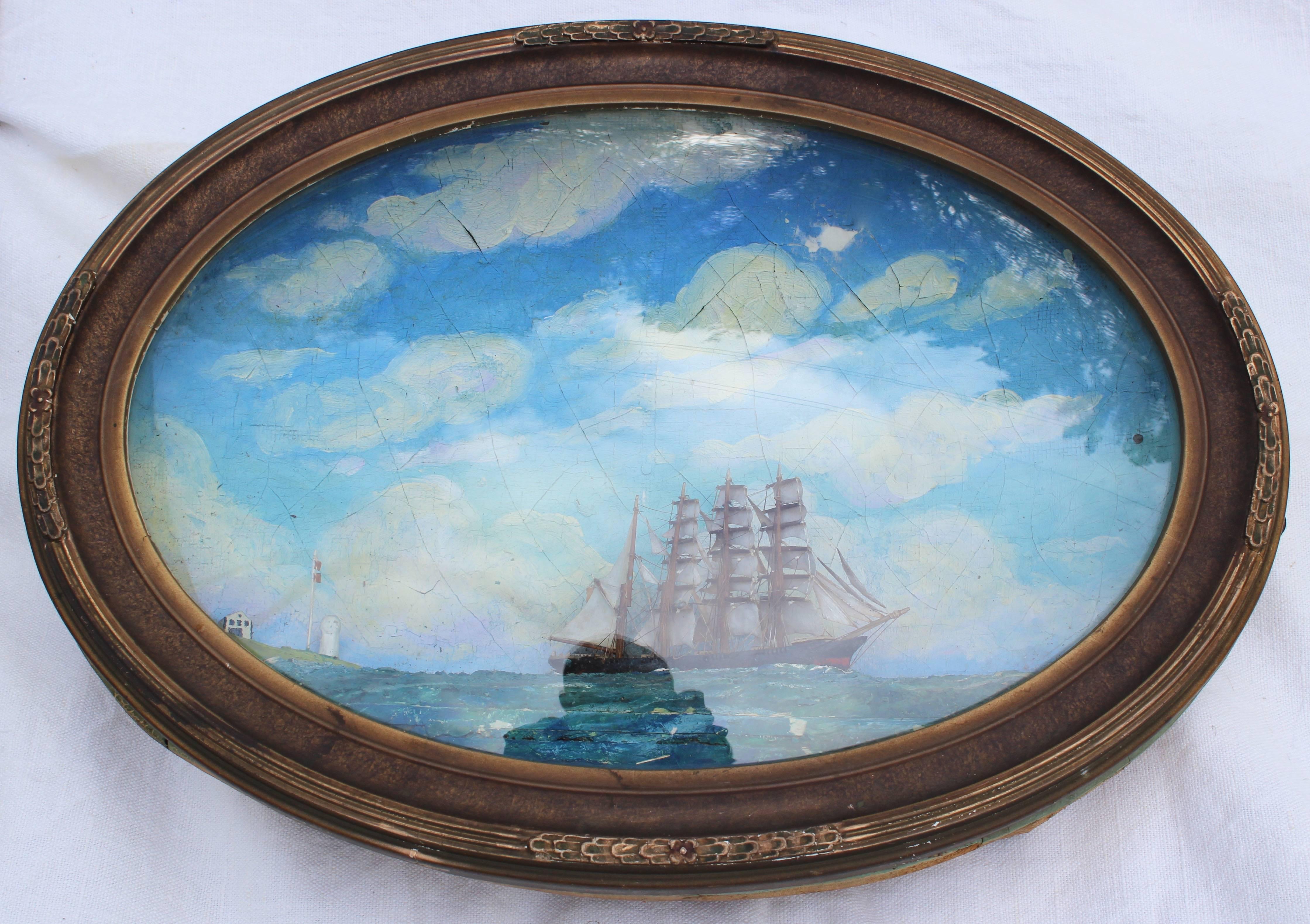 Unique oval concave clipper ship shadow box with convex glass.