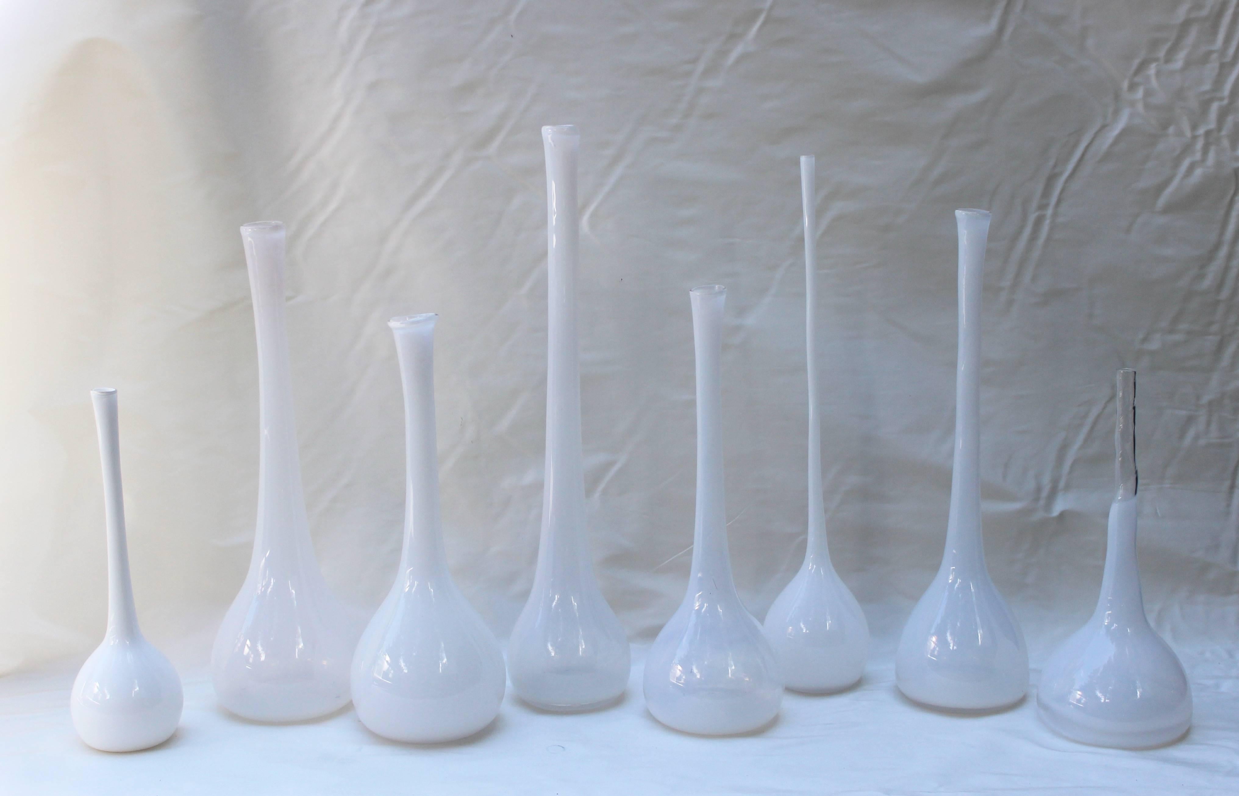 Great collection of eight white handblown glass vases of slightly varying depths and heights by artist Michael Anchin. Measures diameter of all 8 is approximately 4.5