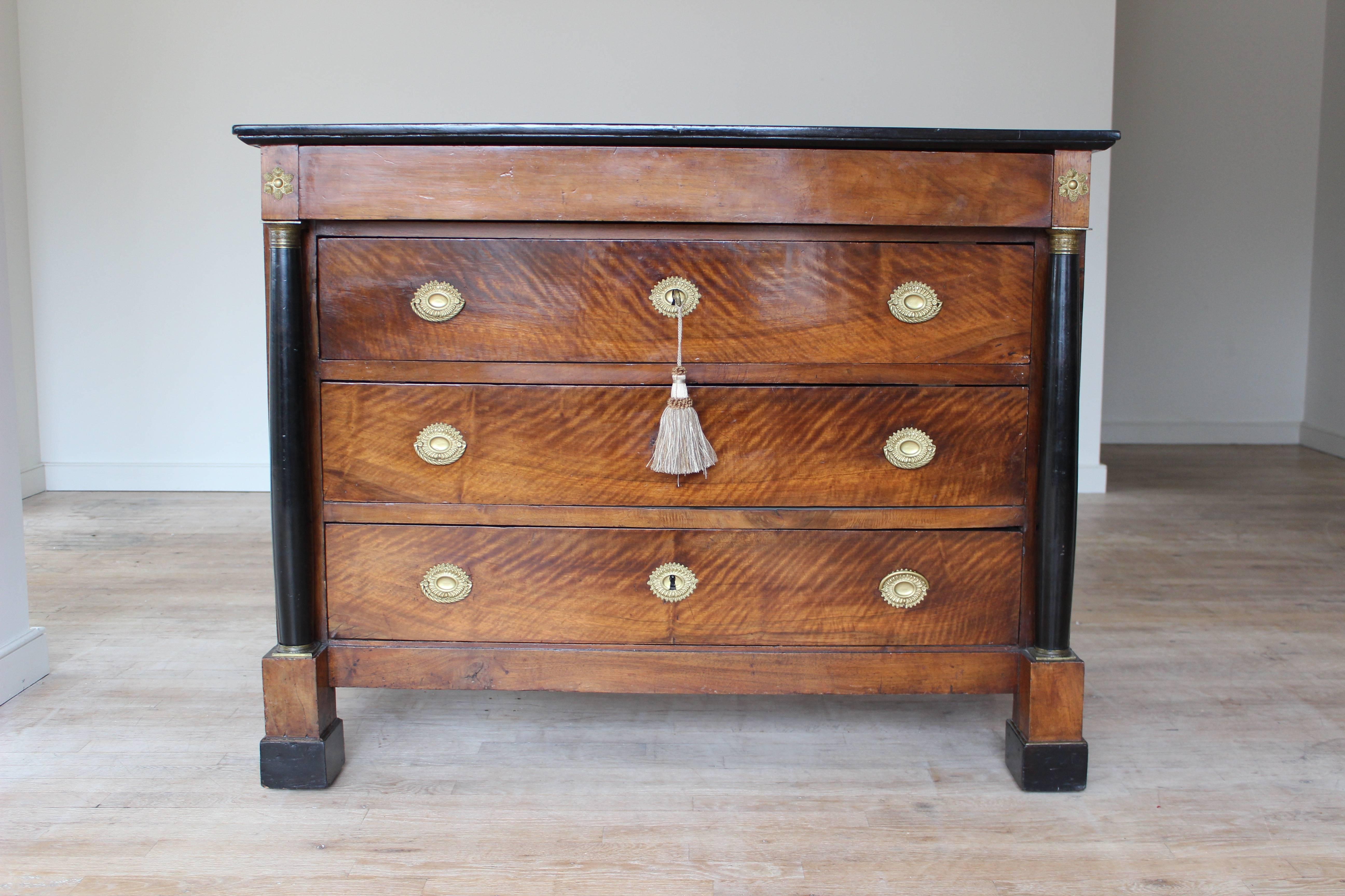 French Empire Chest of Drawers with rectangular ebonized over a concealed top drawer and three long drawers. Some wear and restorations. Replaced hardware.
