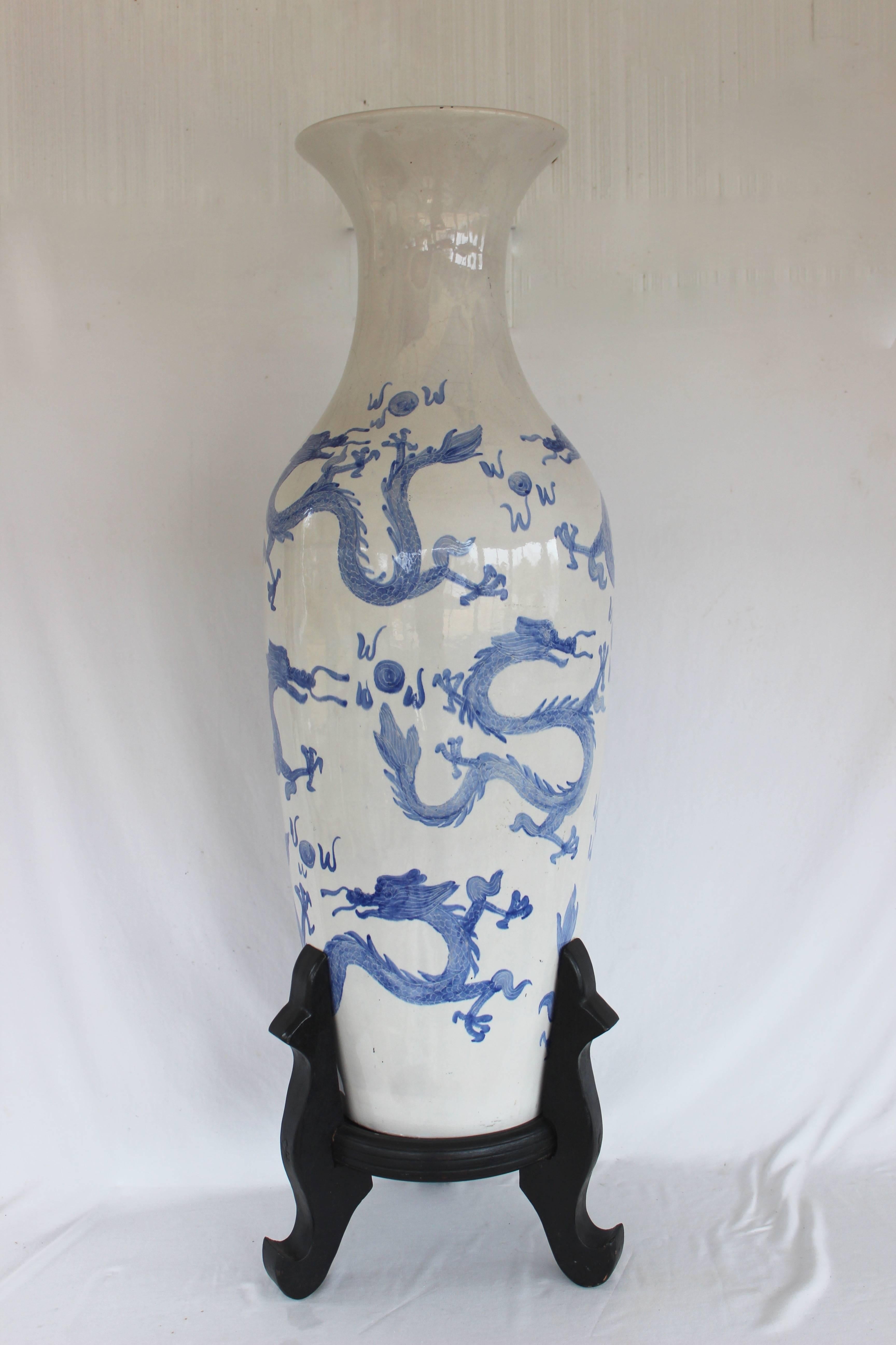 Large Chinese Blue and White Palace Size Floor Vase with wooden tripod stand.

Vase without stand measures 36