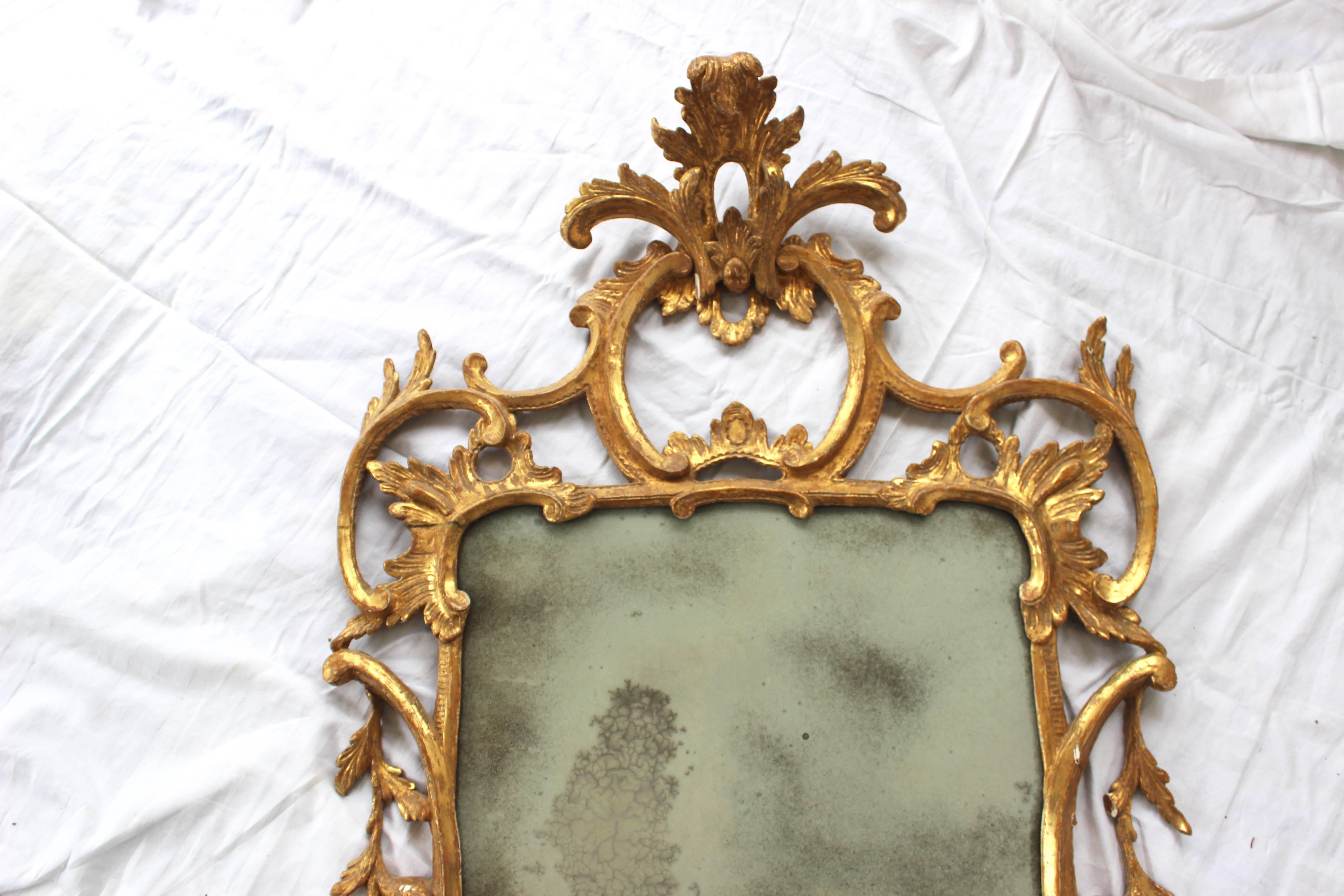 George III Style Gilt-wood Mirror with open scrollwork and rose garland.