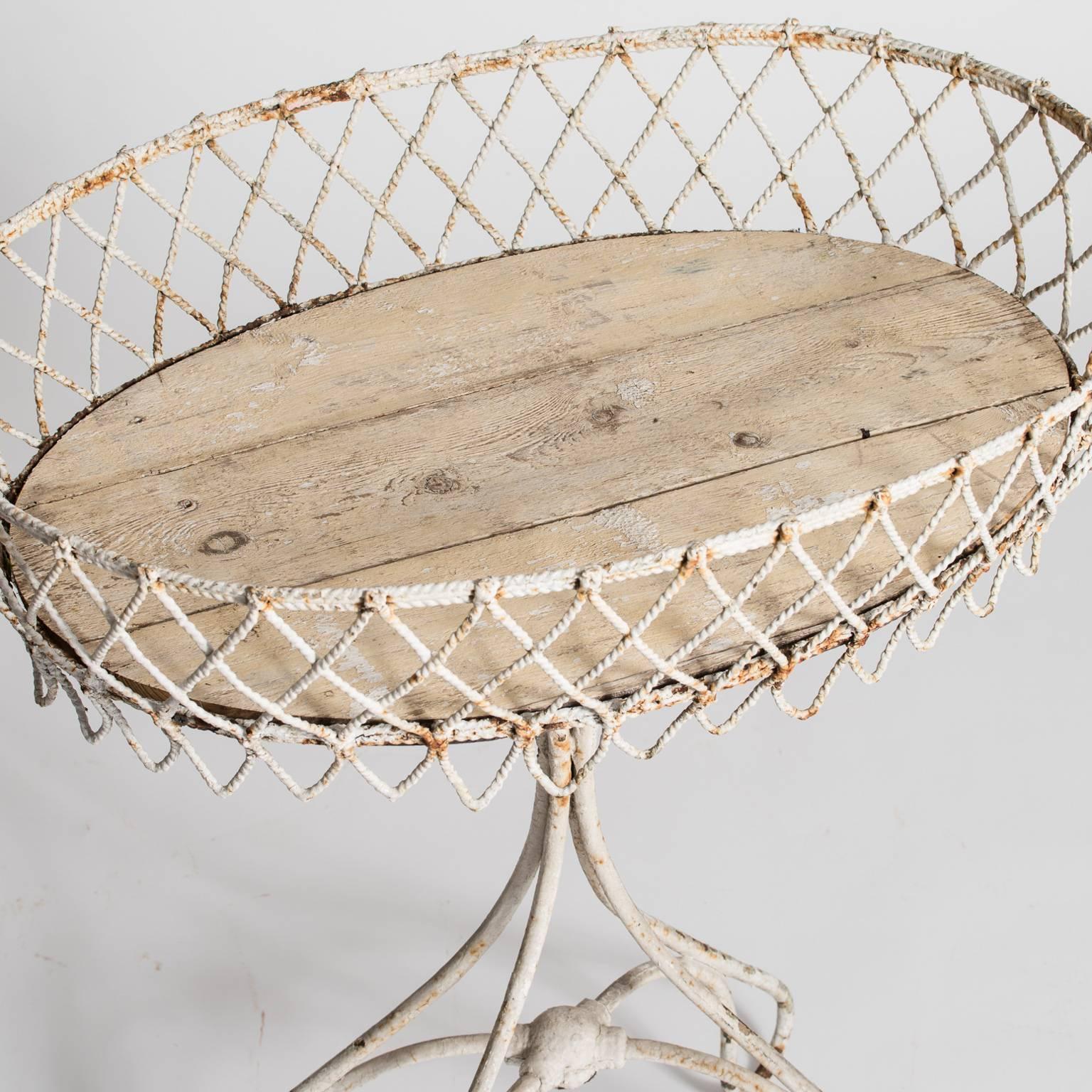 A very pretty oval shape and a criss-cross basket weave pattern give this French late 19th century jardinière a great look especially when it is overflowing with flowers. It retains the old wooden liner.
 
$1,400.
Measures: 29” wide,
22”