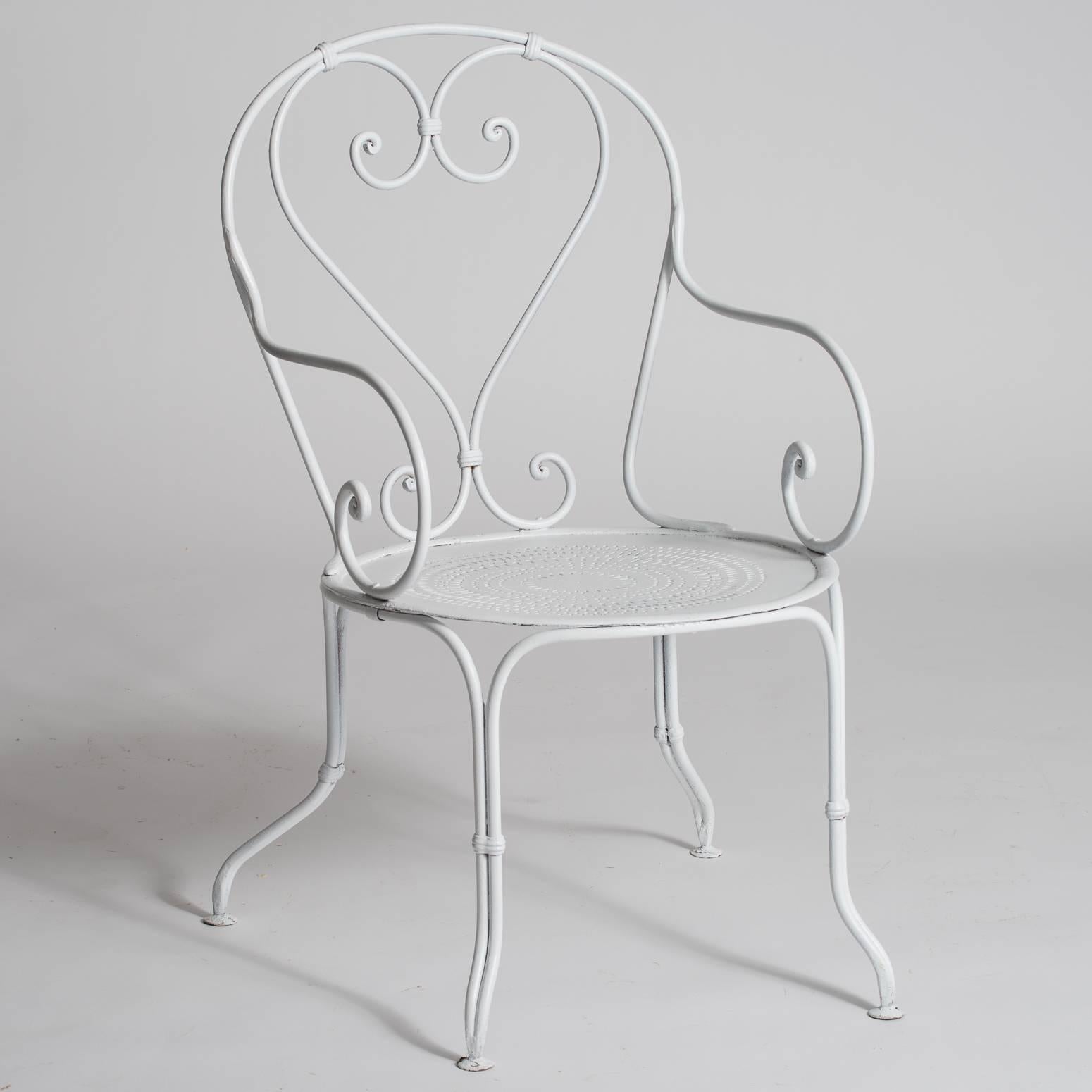 This set of four Classic French wrought iron garden armchairs with pierced seats is in great condition and has been recently repainted white with outdoor paint. They are very sturdy and of great quality.
 
$5,600.
Measures: 39.5"