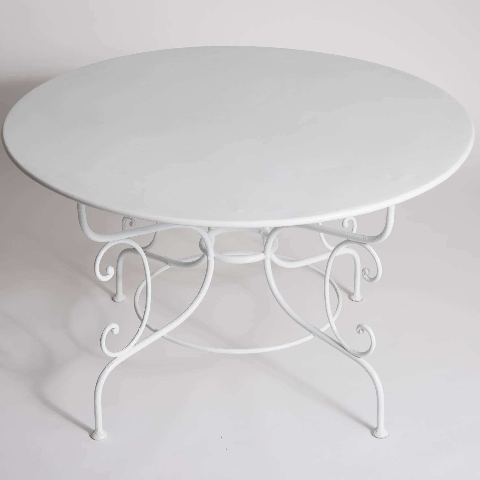 This great Classic French garden dining table seats six and has an intricate scroll base. It has recently been repainted in weather resistant outdoor paint.

Note: Pictured with French wrought iron chairs, Dawn Hill, available