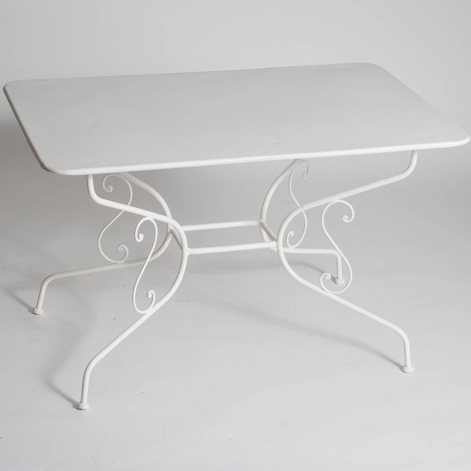 A perfect size for dining, this rectangular table can easily fit six people. It has a beautiful scrolled base with an intricate design. It has recently been repainted with white outdoor weather-proof paint.
 
$3,200.
Measures: 28.5″ high,
46.5”