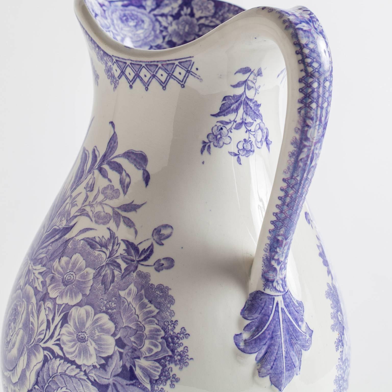 This pitcher with voluptuous bouquets of lavender blossoms is marked; “Jardiniere” Sarreguimines, France.

10.5” high
7.5” wide.