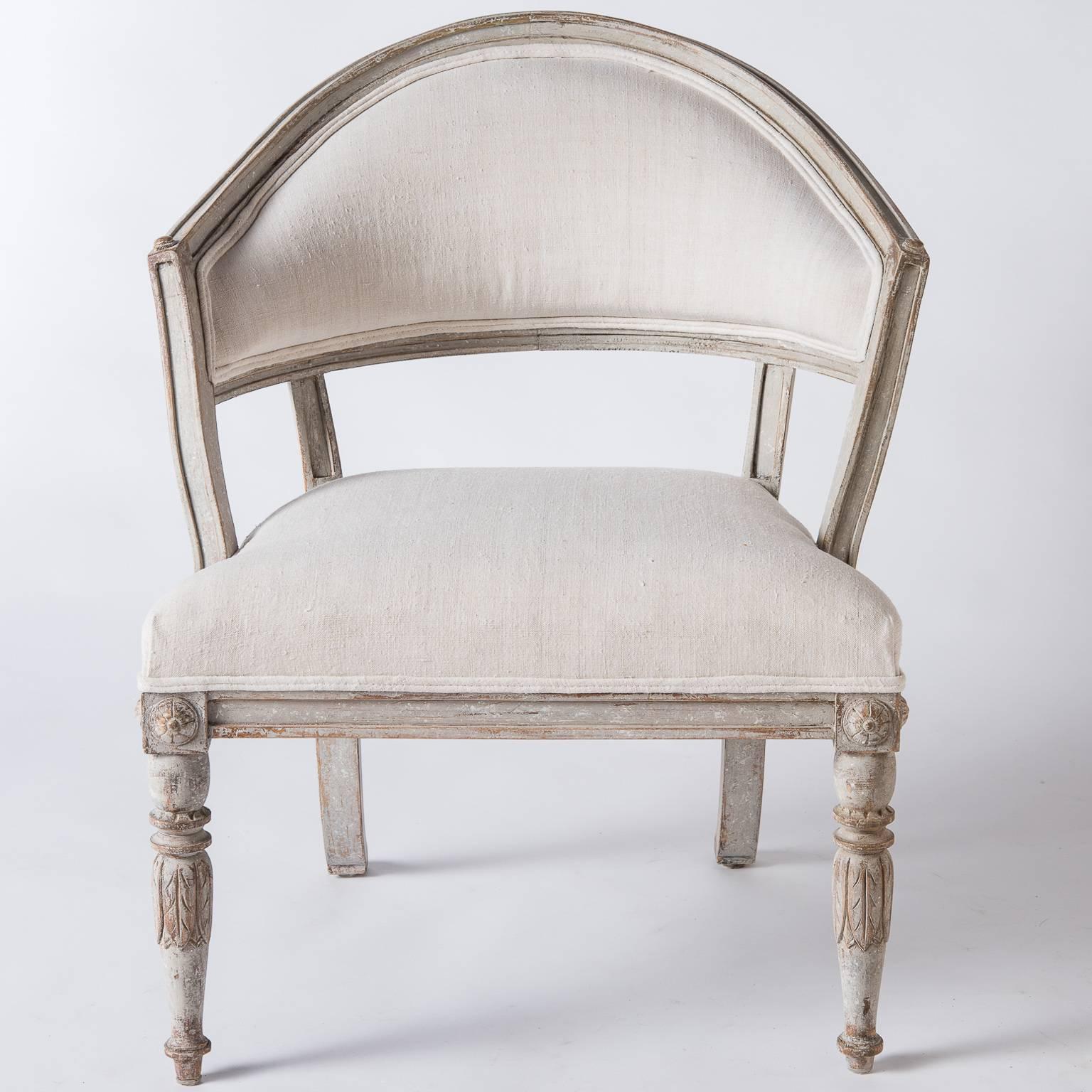 These impressive chairs have many wonderful qualities; the grey paint surface is original, they have detailed carvings with rosettes at the side of the aprons, and acanthus leaf carvings grace the front legs, but, most importantly, is how