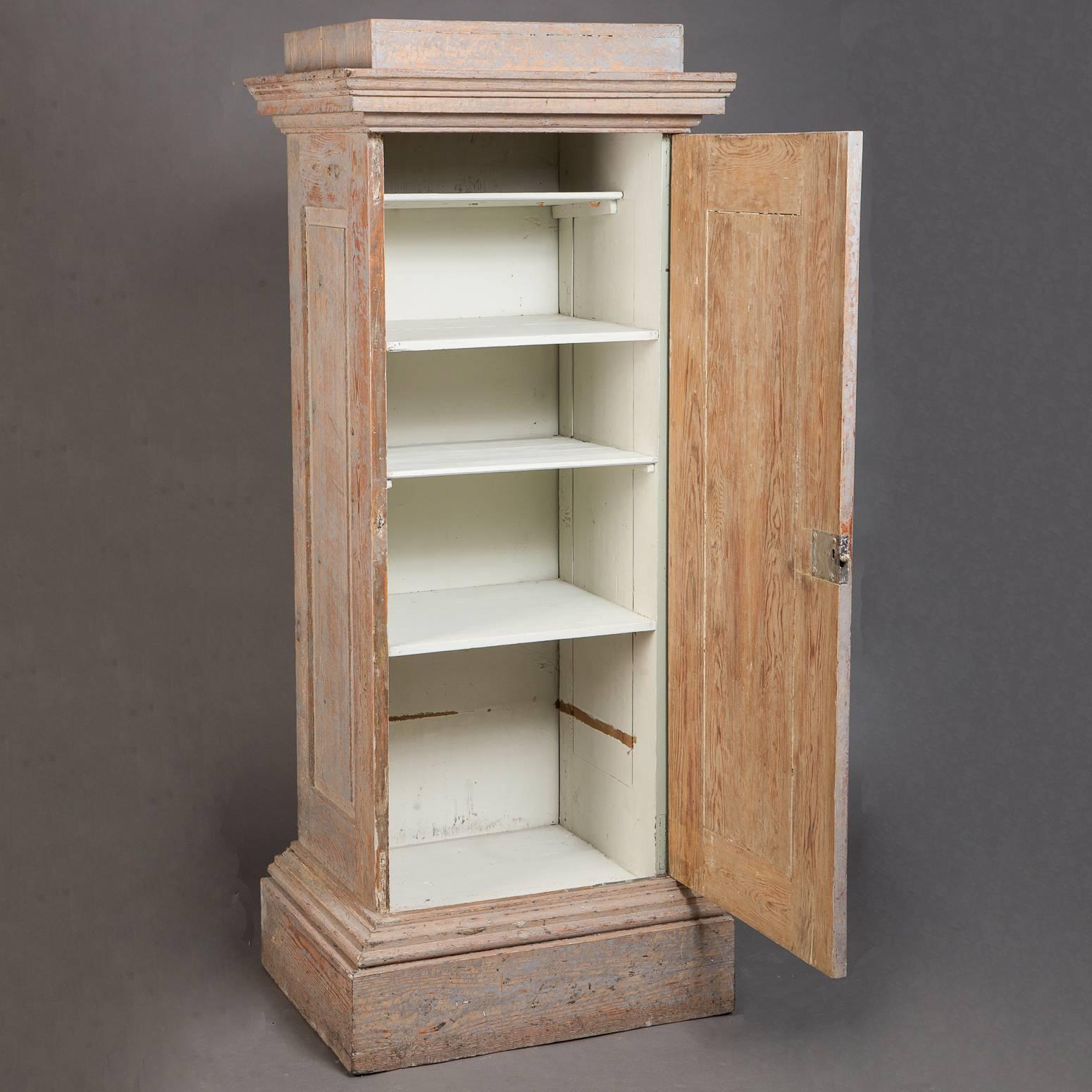 Another great contribution of Swedish design, this cupboard looks like an elegant column but it is extremely useful for storage. With the door opened it works as a display piece, and closed for storage of linens or dishes in a dining room. The pale