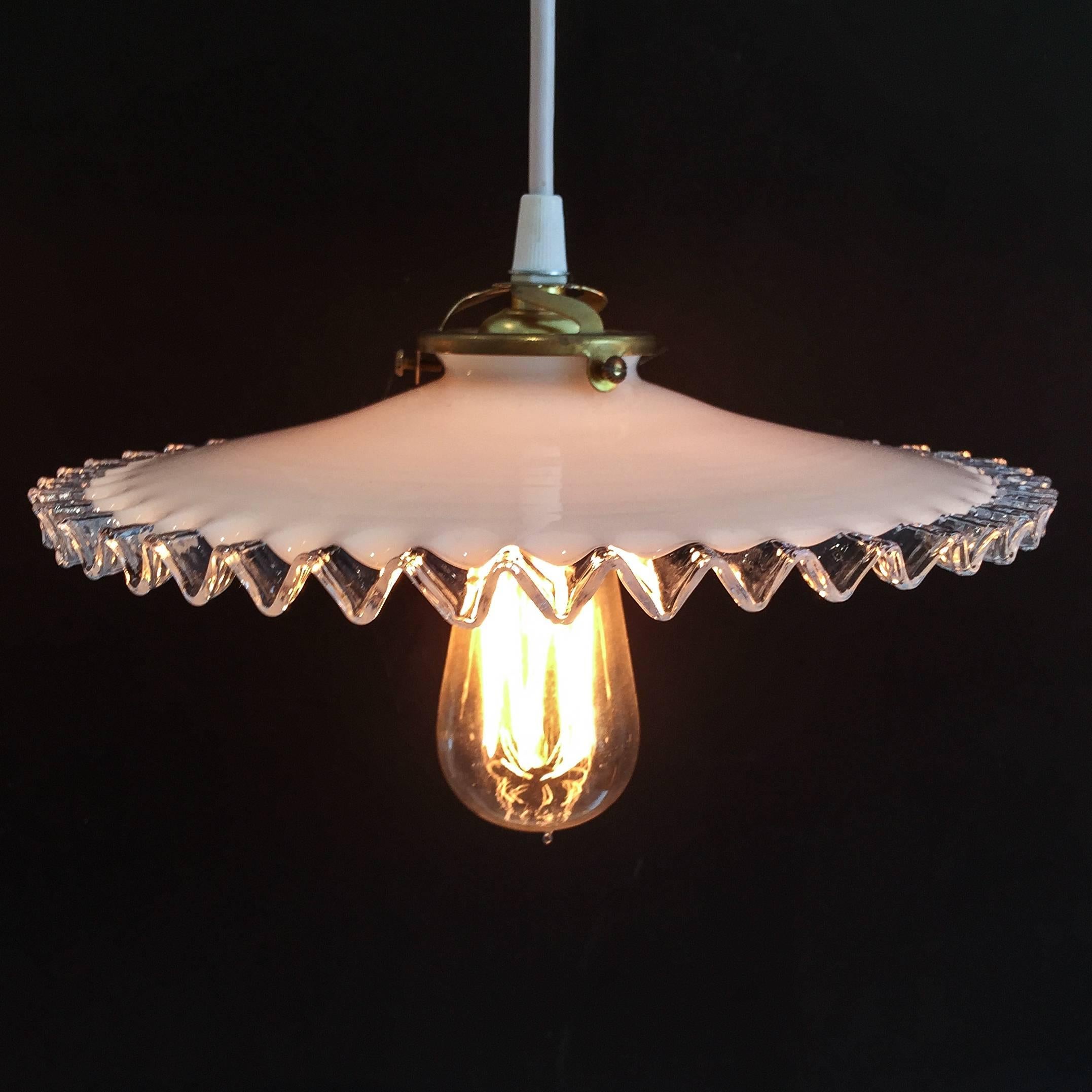 A Dawn Hill Antiques exclusive, these French hanging lights with milk glass ripple shades, are each assembled by us using late 19th century shades that we find in France. Each shade is antique, and has slight charming differences to them. They can