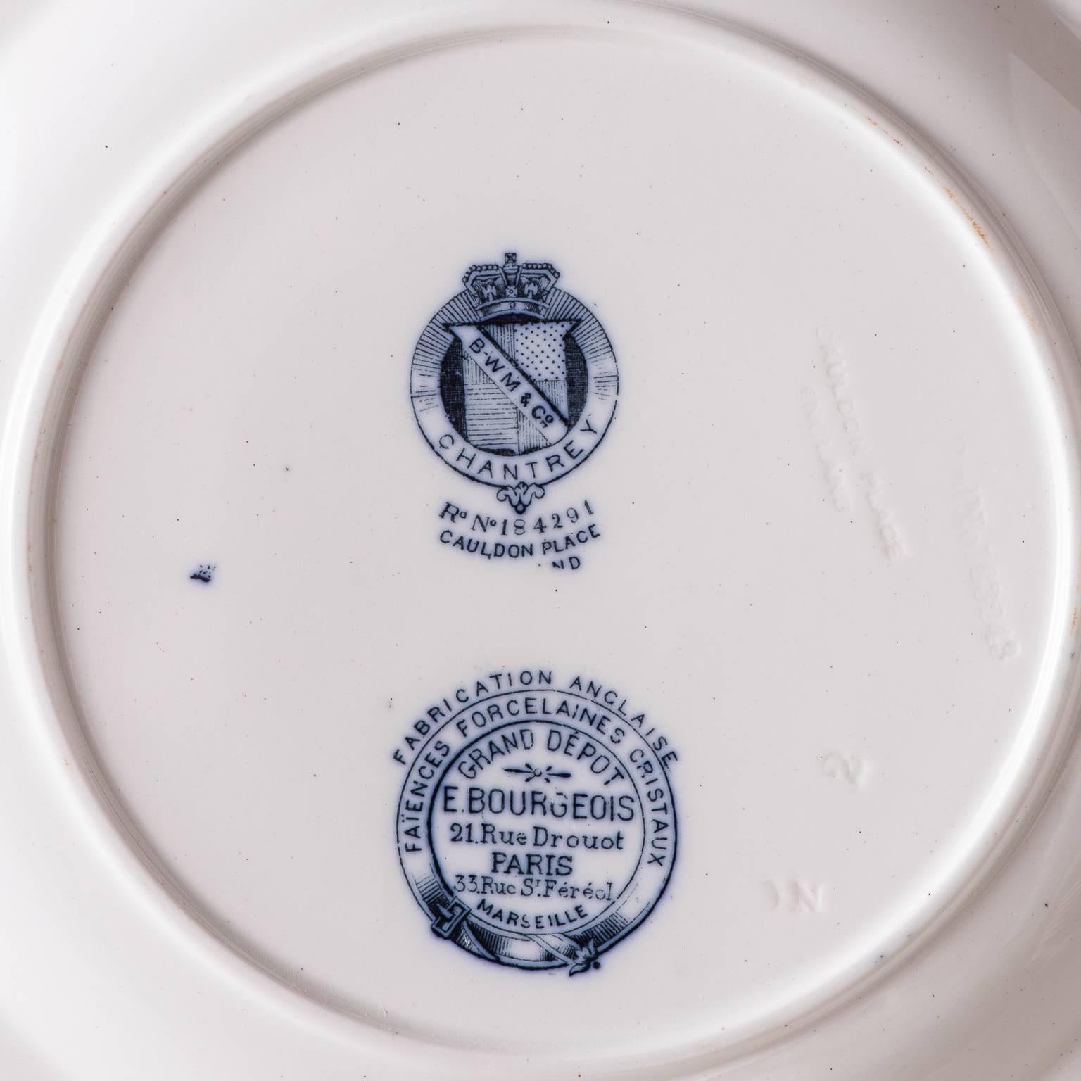 This charming dinner service was made by Cauldon of England, but for the French market and has the mark of E. Bourgeois, Paris. The pattern, “chantry,” is an interesting one that features various flowers and fruit expressed in different
