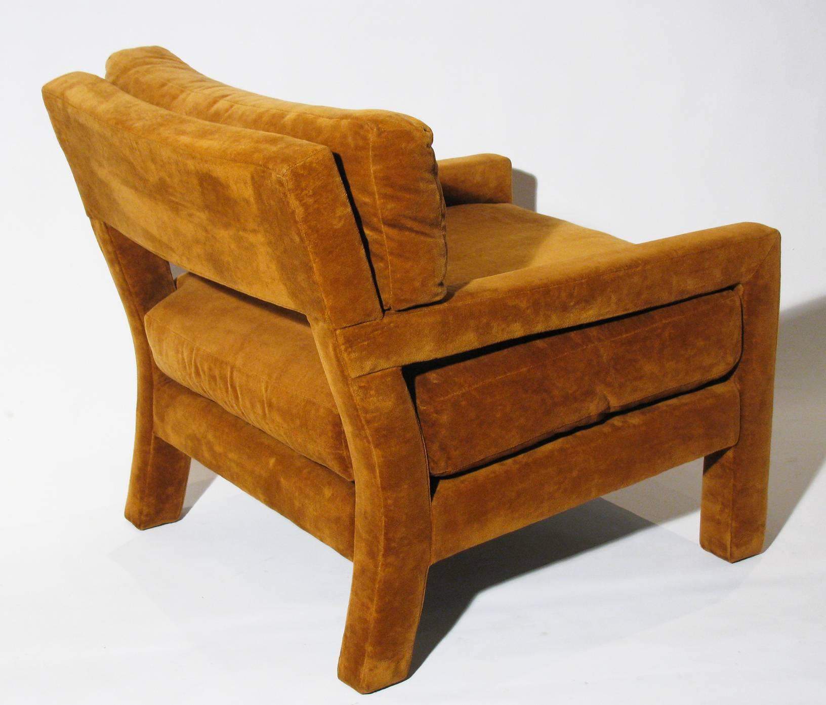 A pair of open-arm lounge chairs by Milo Baughman, in original dark camel color upholstery.