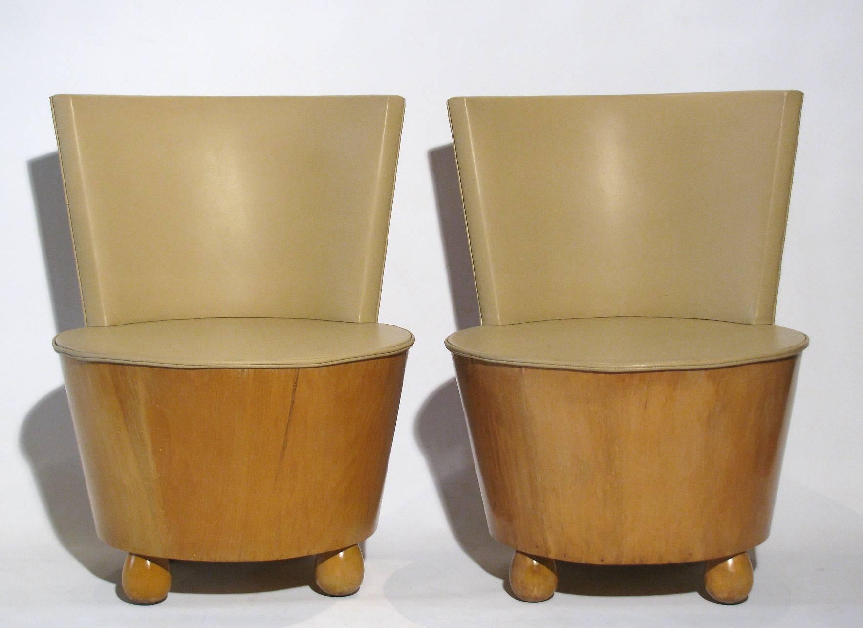 A chic pair of Art Deco style tub chairs attributed to Elsie de Wolfe. Seat height measures 14 inches without cushion.