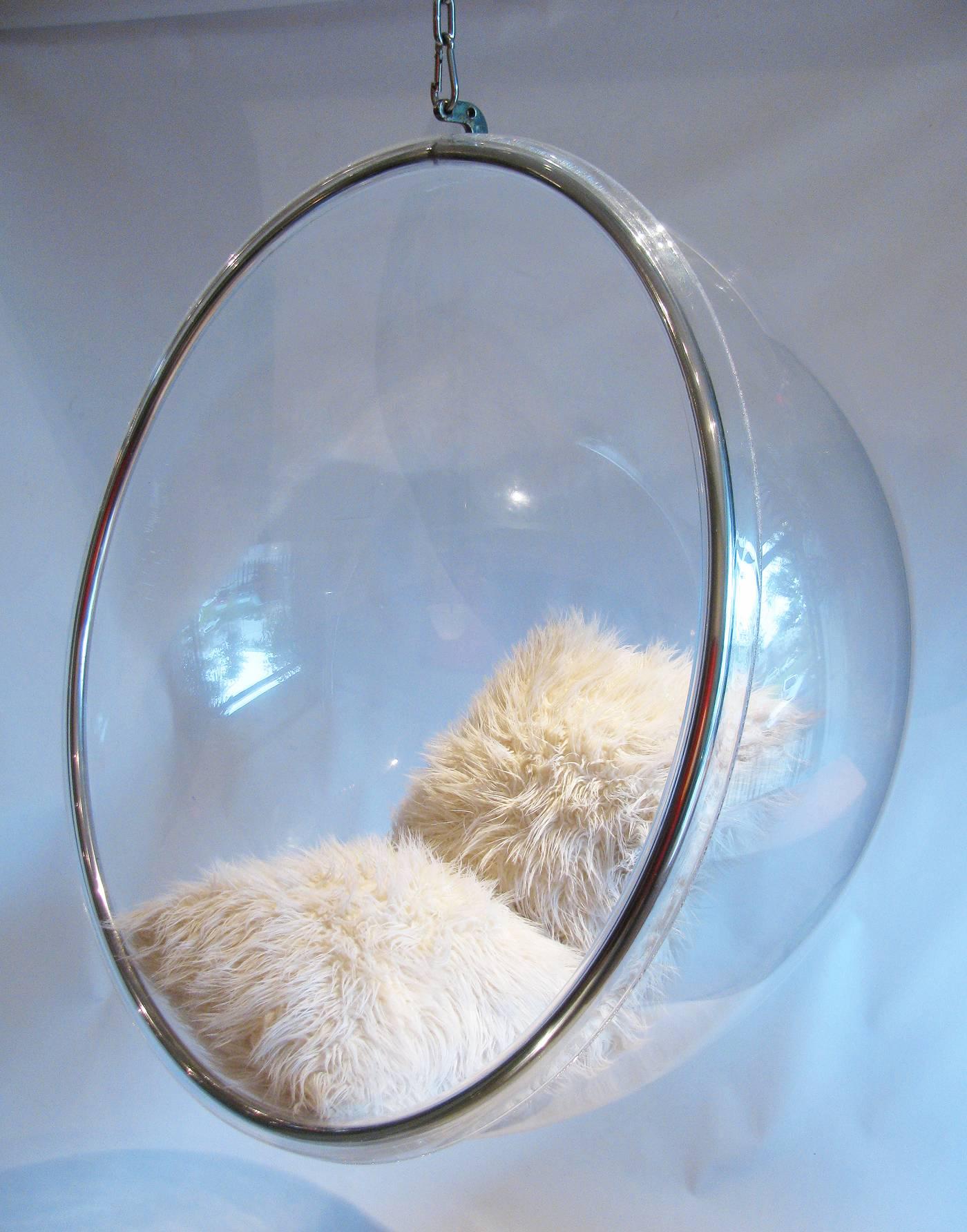 A chic and sexy Eero Aarnio style hanging acrylic ball chair. Heavy chrome chain measures 44 inches length. Flokati pillows not included. Unsigned.