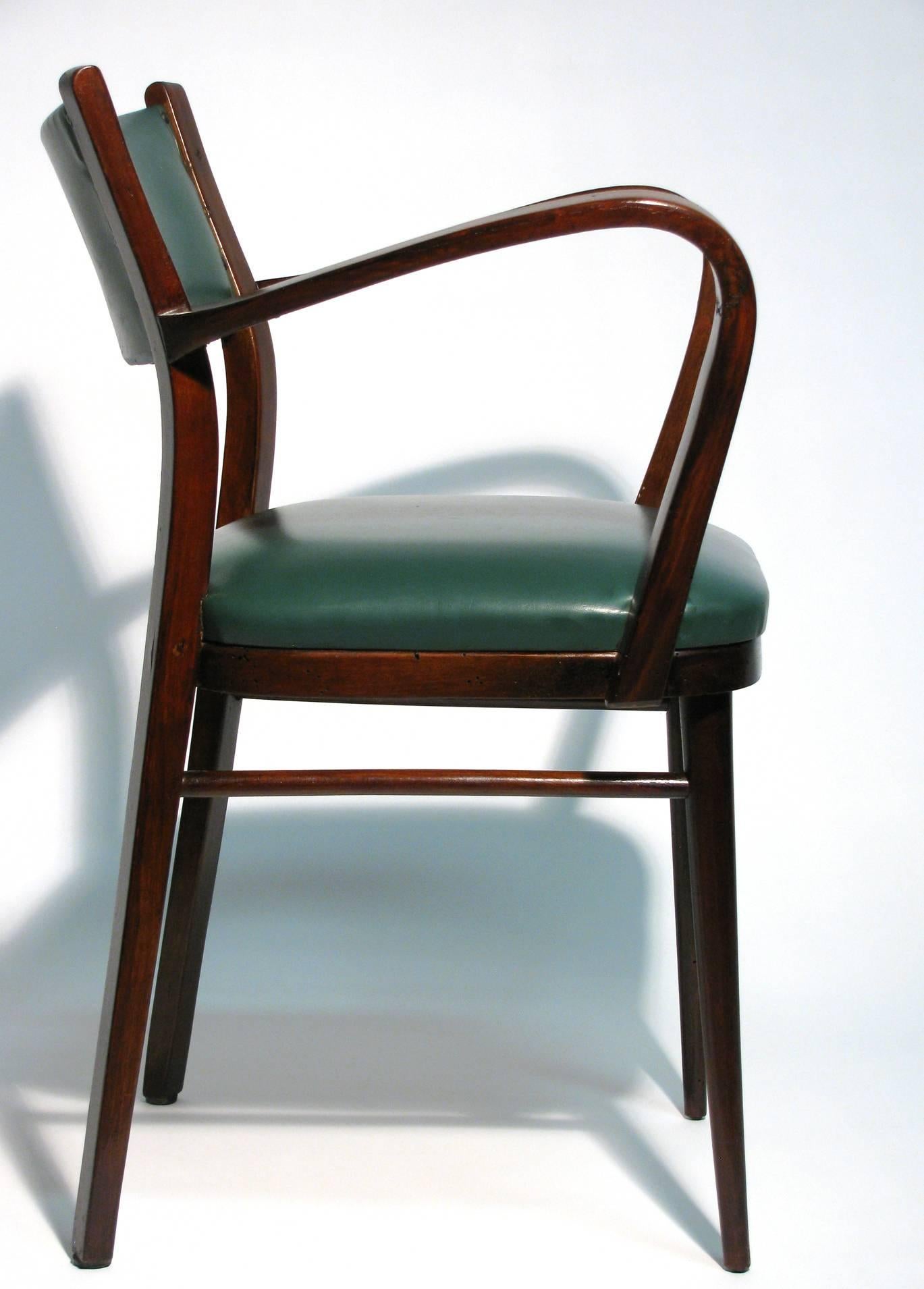Classical style Italian bentwood chair with elaborate curved arms, side stretchers, and tapered legs. Upholstered with forest green faux leather, and trimmed with brass nails.