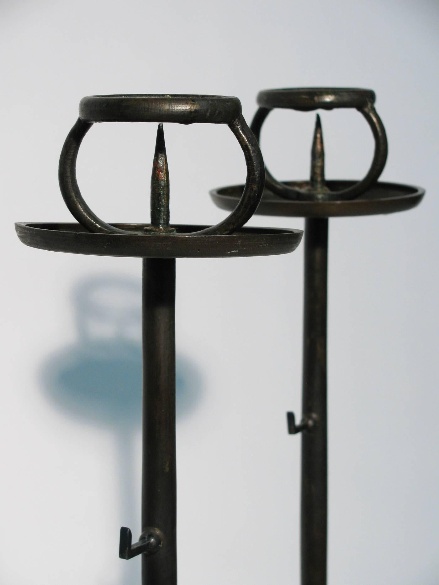 A stunning pair of Meiji period (October 23, 1868 through July 30, 1912) bronze candle stands, with decorative rolled beeswax.