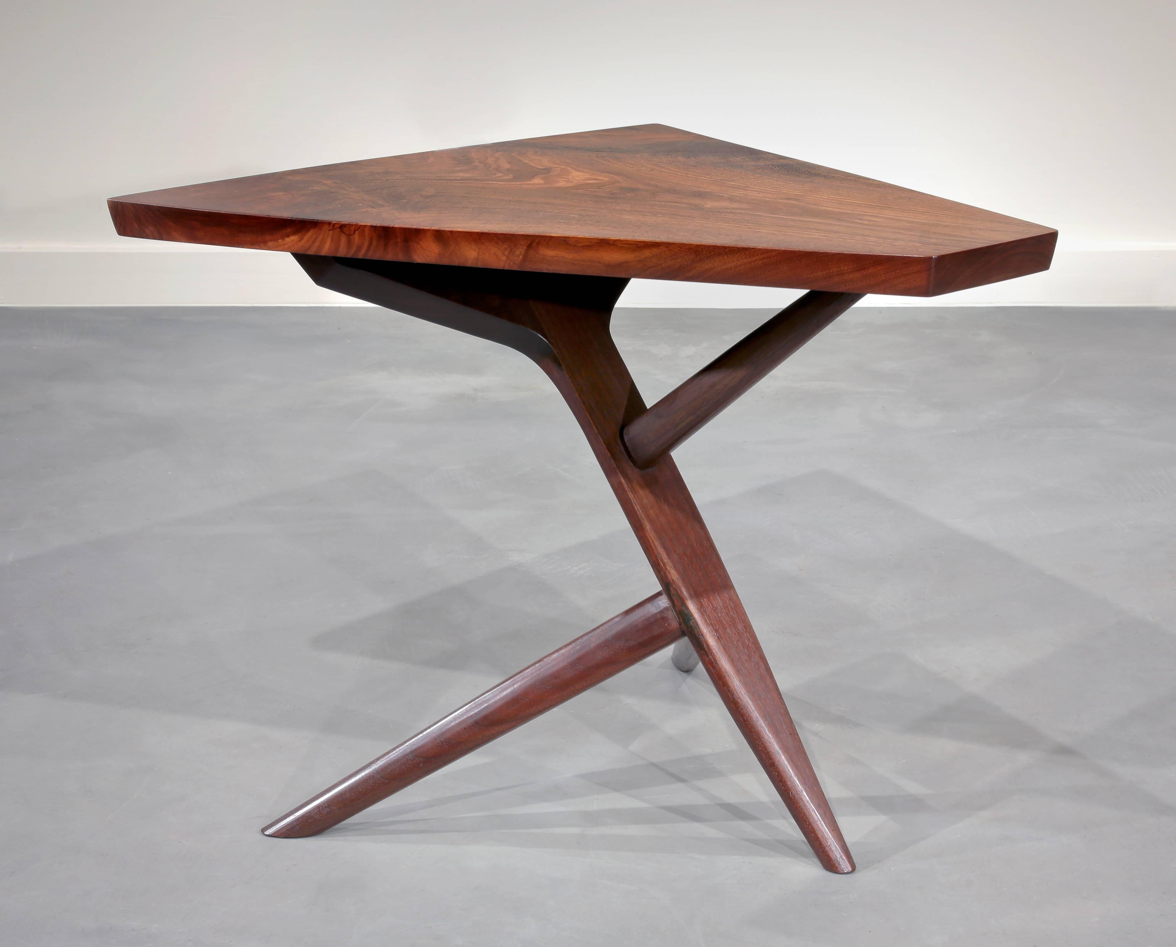 Highly figured American black walnut on Nakashima's very architectural cross-legged base. One of his most iconic designs.