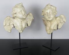 Pair of Papier Mâché Cherubs on Iron Bases