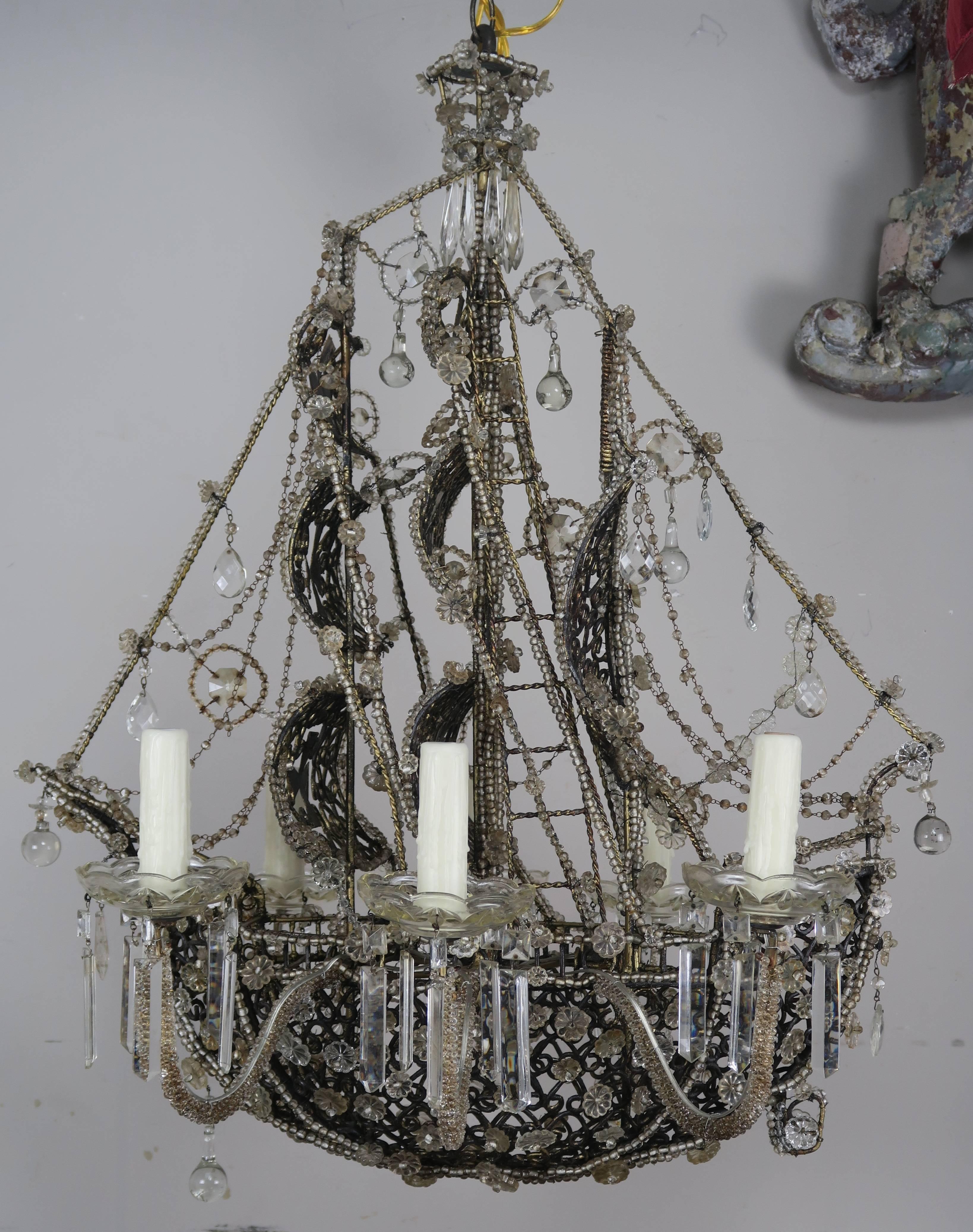 Unique French six-light crystal beaded ship chandelier newly rewired with drip wax candle covers. Incredible details. Includes chain and canopy.