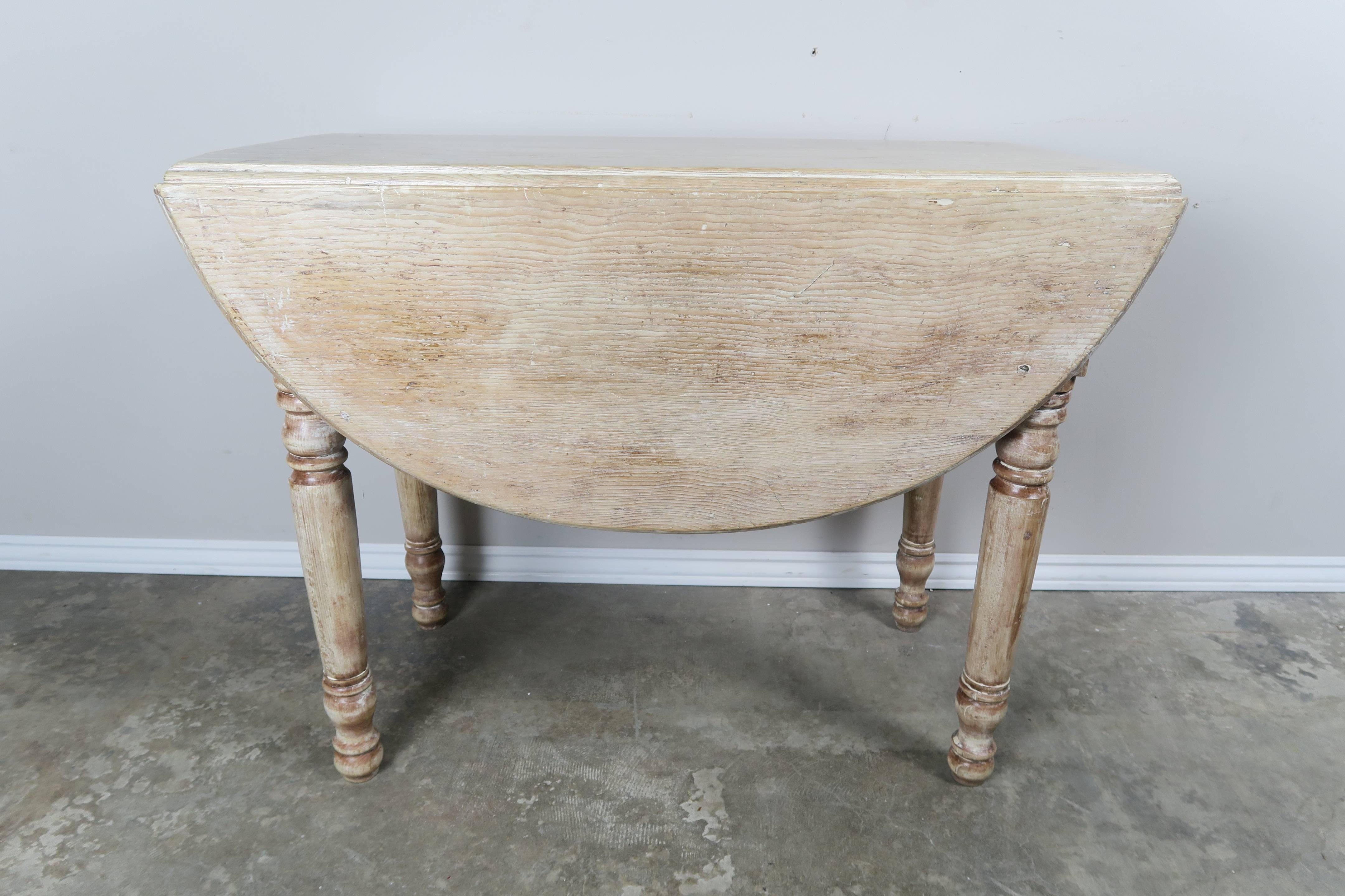 English drop-leaf table with natural pine washed finish. Perfect for a small apartment or studio.