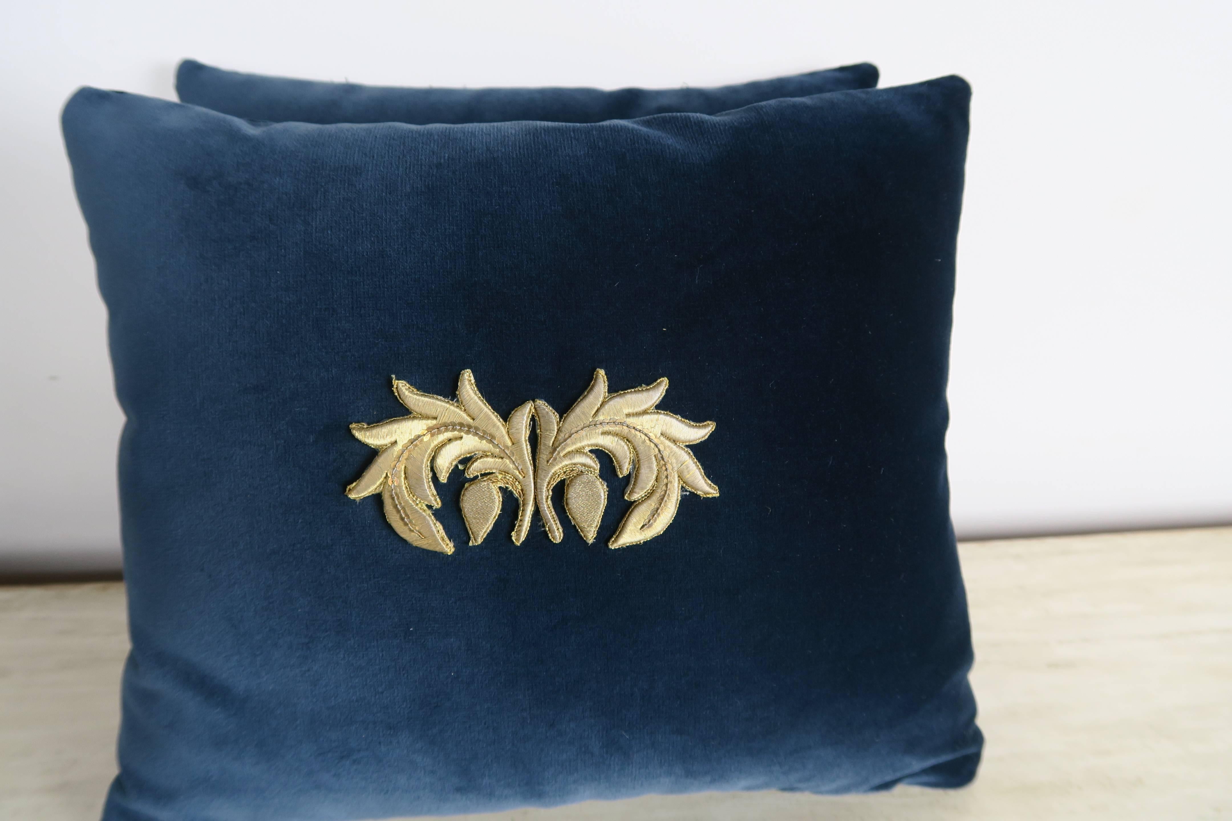 Pair of custom pillows by Melissa Levinson made with 19th century gold metallic appliques attached to midnight colored silk velvet fronts and backs. Down inserts, zipper closures.