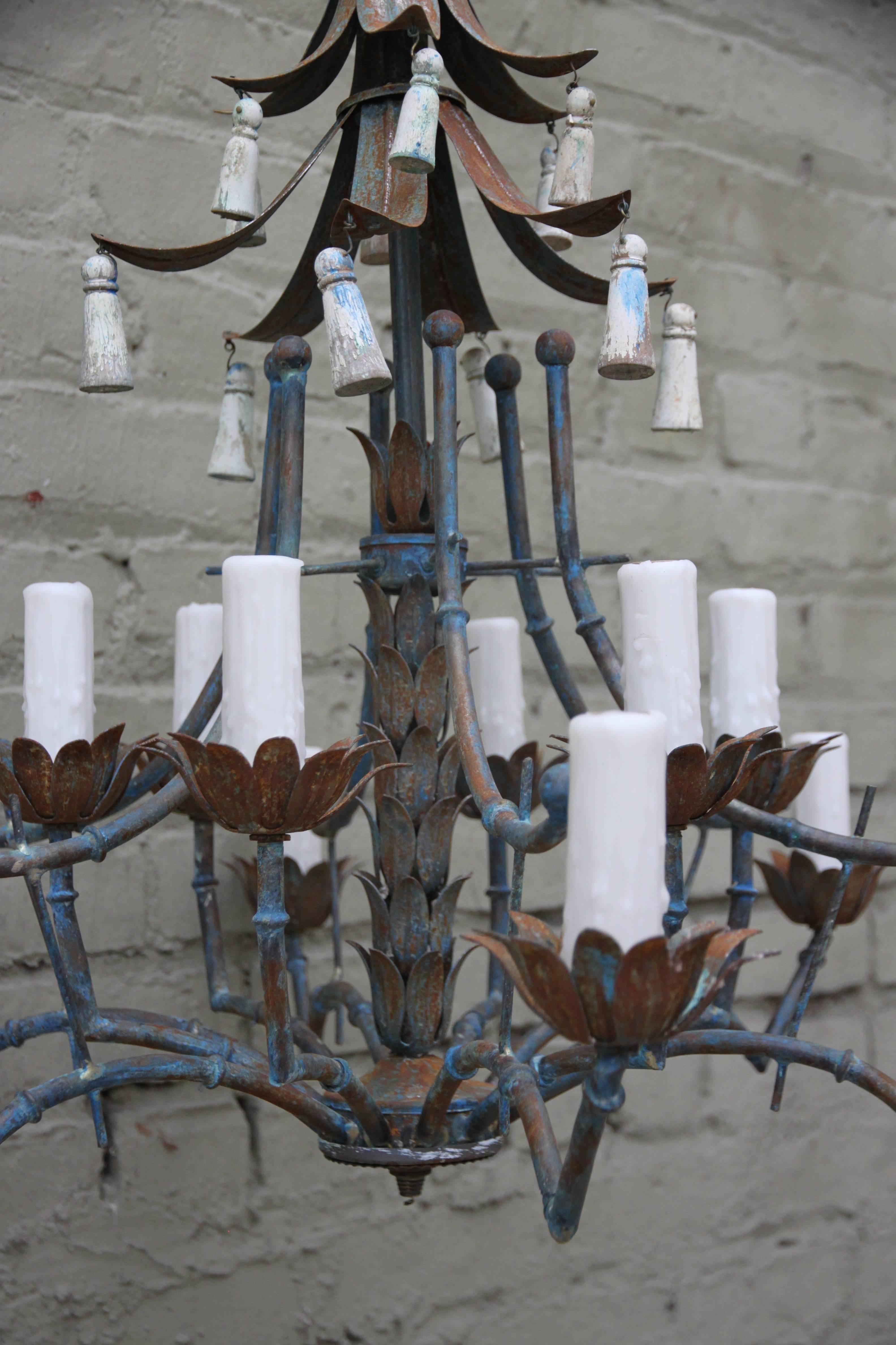 Italian (12) light Chinoiserie wrought iron chandelier w/ remnants of color throughout from original paint.