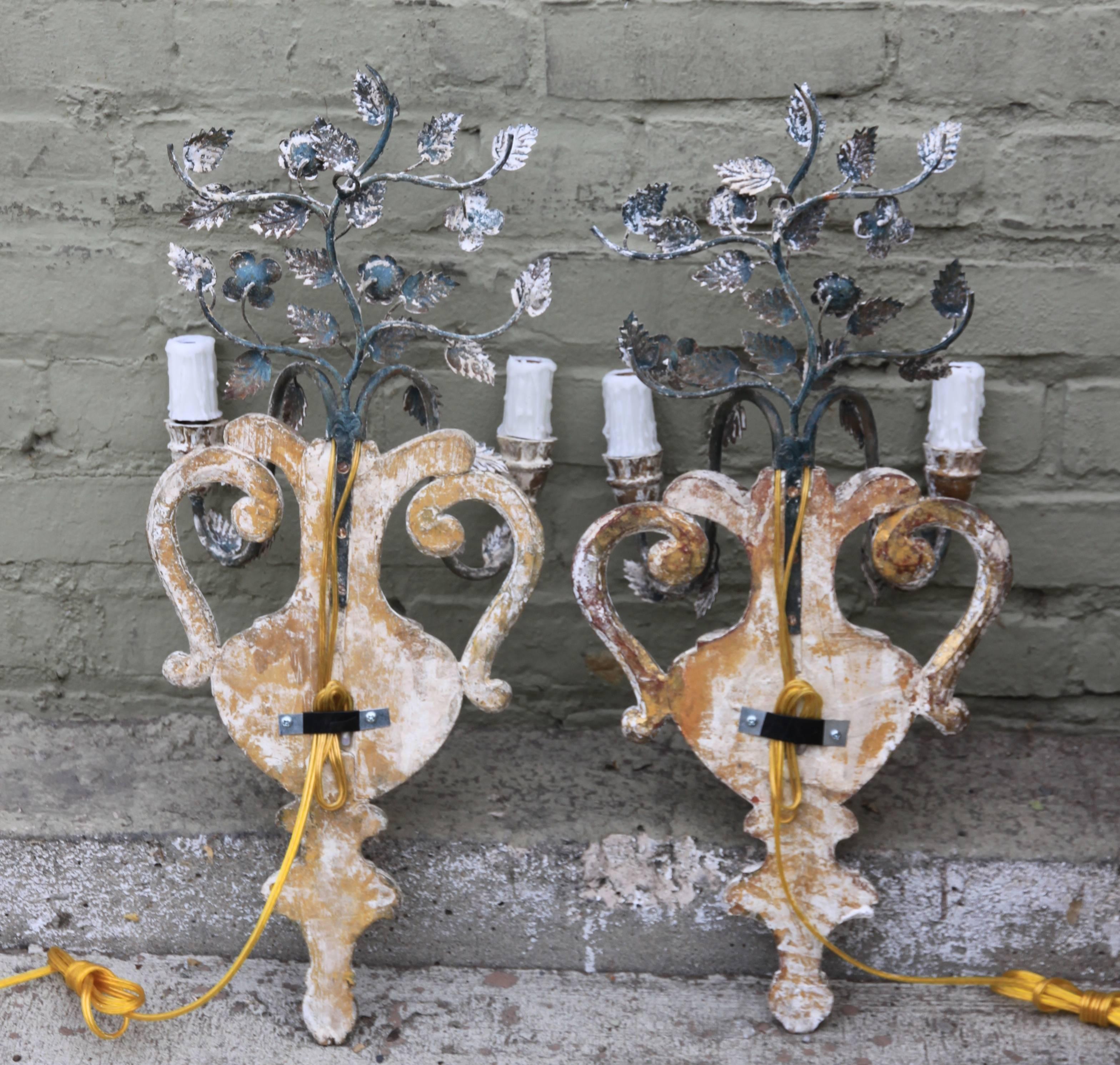 Mid-20th Century Pair of Italian Two-Light Carved Wood and Iron Sconces