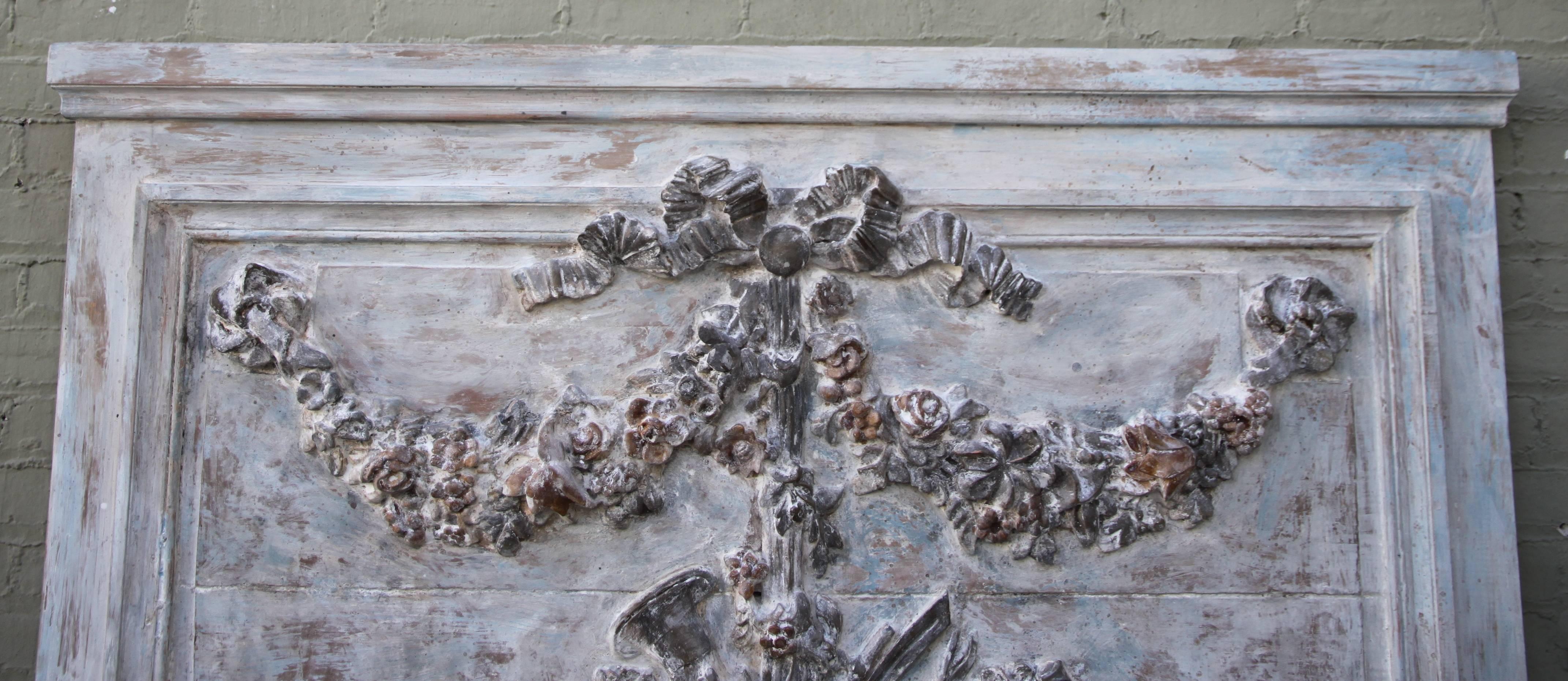 French carved painted Rococo style panel with floral garlands and musical instruments. It could be upholstered into a beautiful headboard or used as a decorative panel.