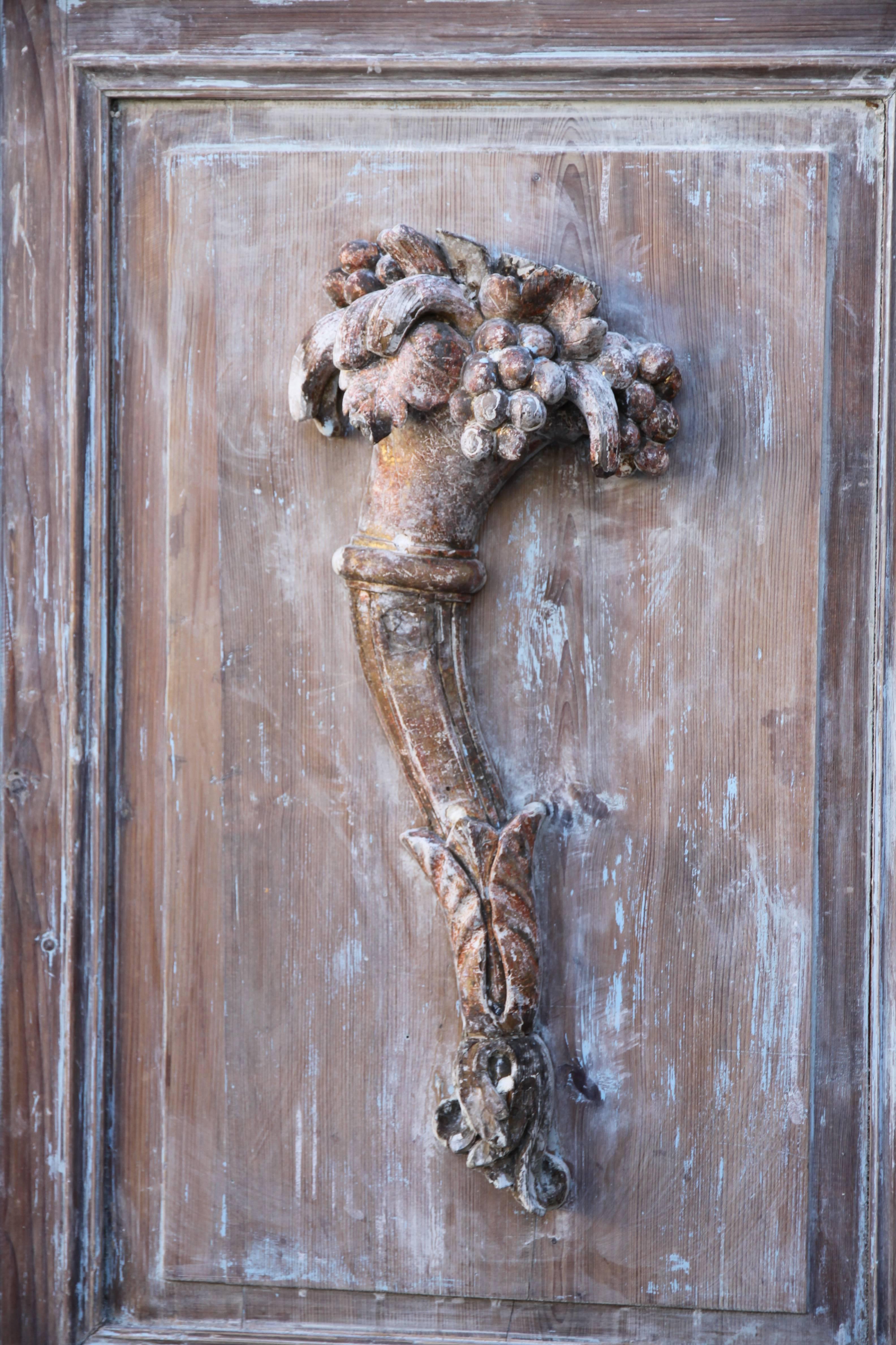 Pair of French wood panels with carved Cornucopias.