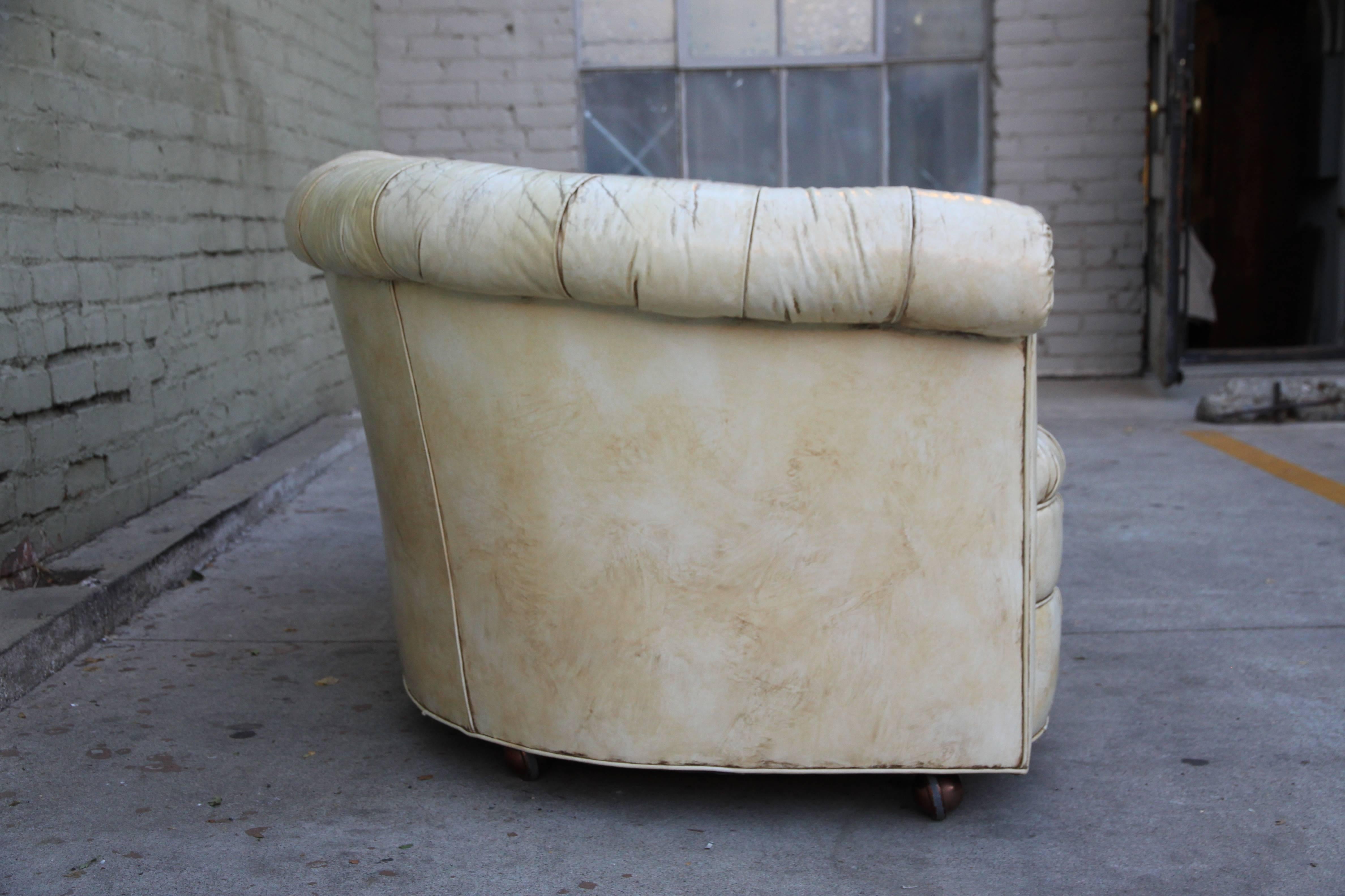 Leather tufted distressed Chesterfield style love seat.
