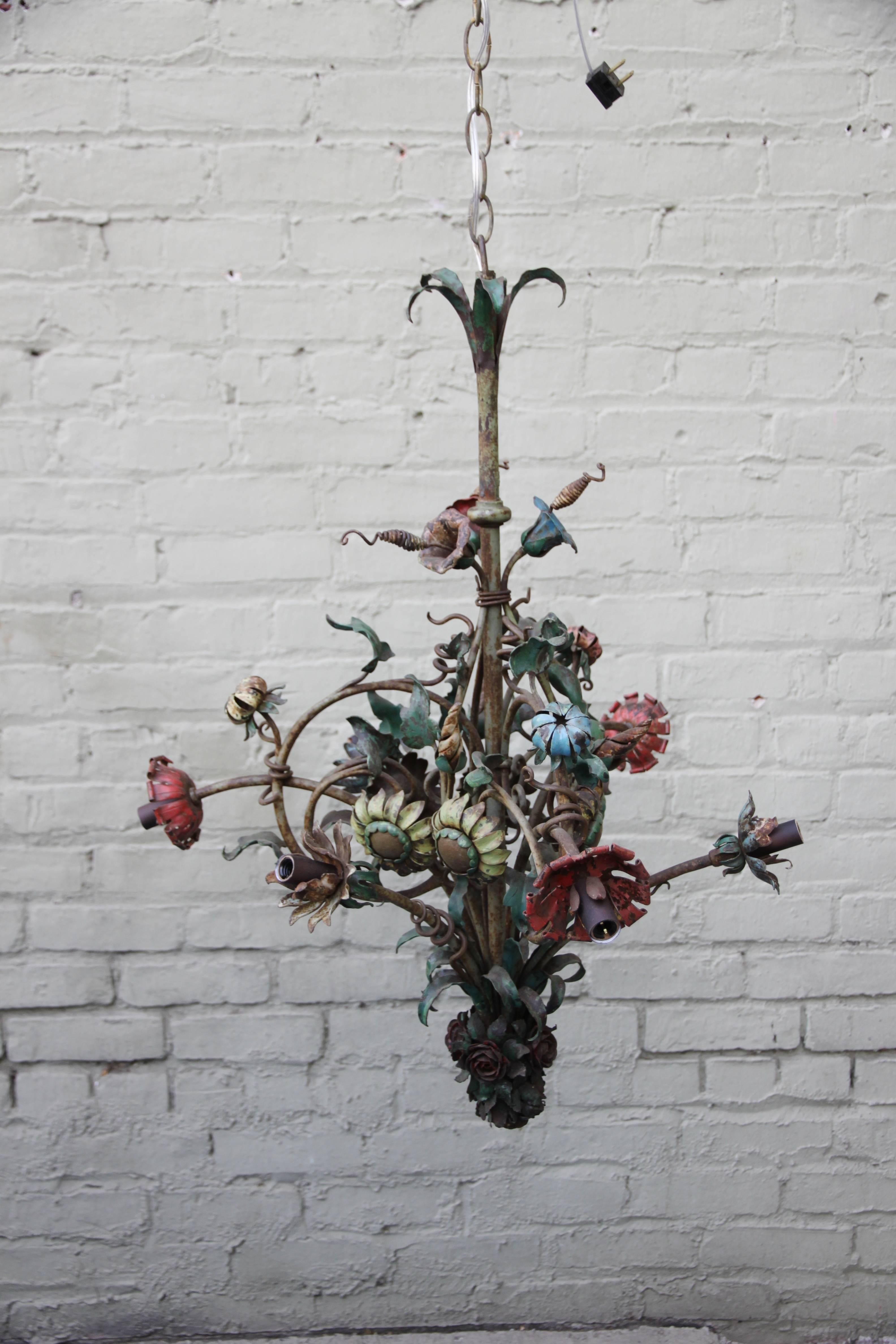 Six-light French wrought iron painted floral chandelier that has been newly rewired with chain and canopy included.