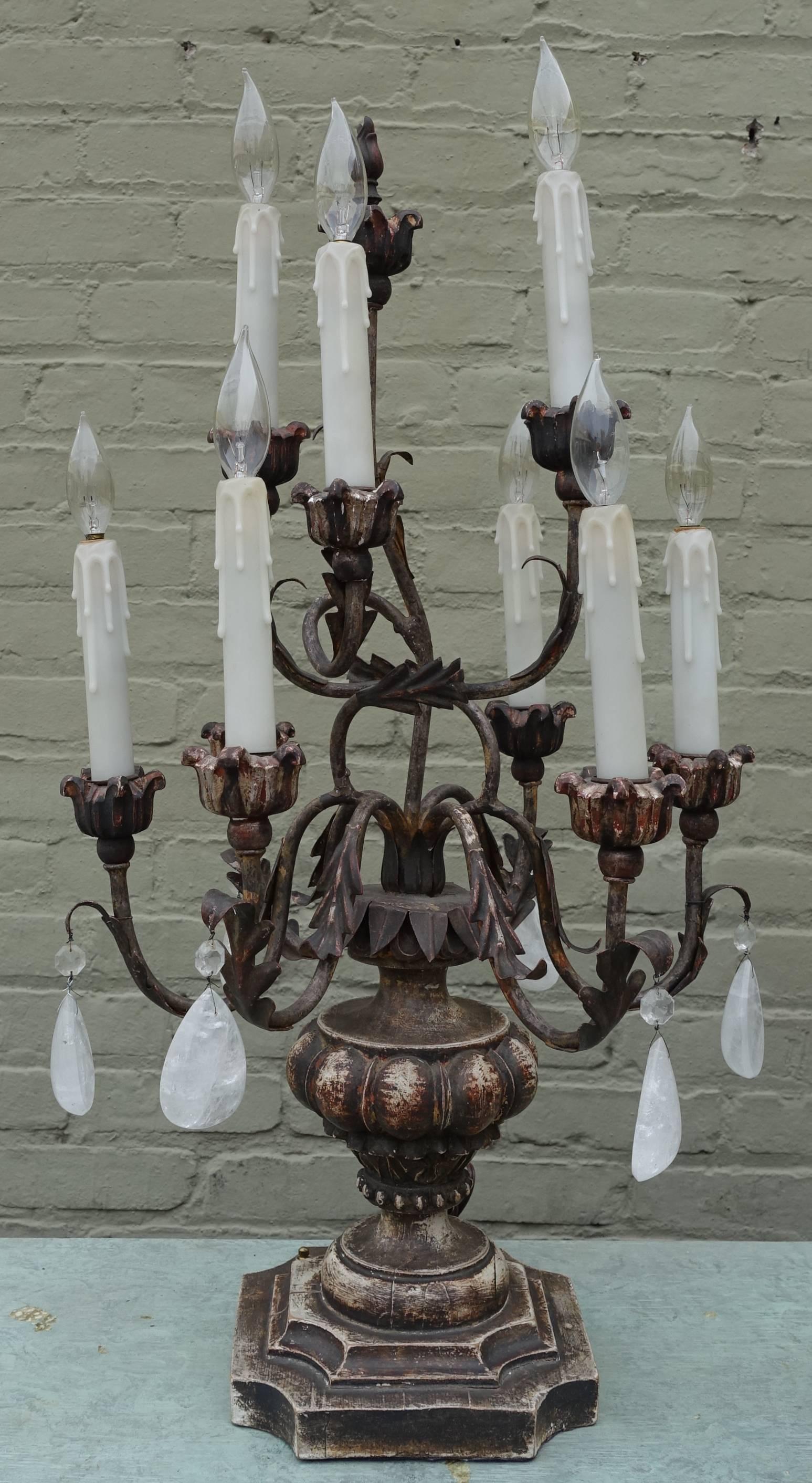 Pair of Italian Rococo style carved painted and parcel-gilt nine-light candelabra. Newly wired with drip wax candle covers and in working condition.