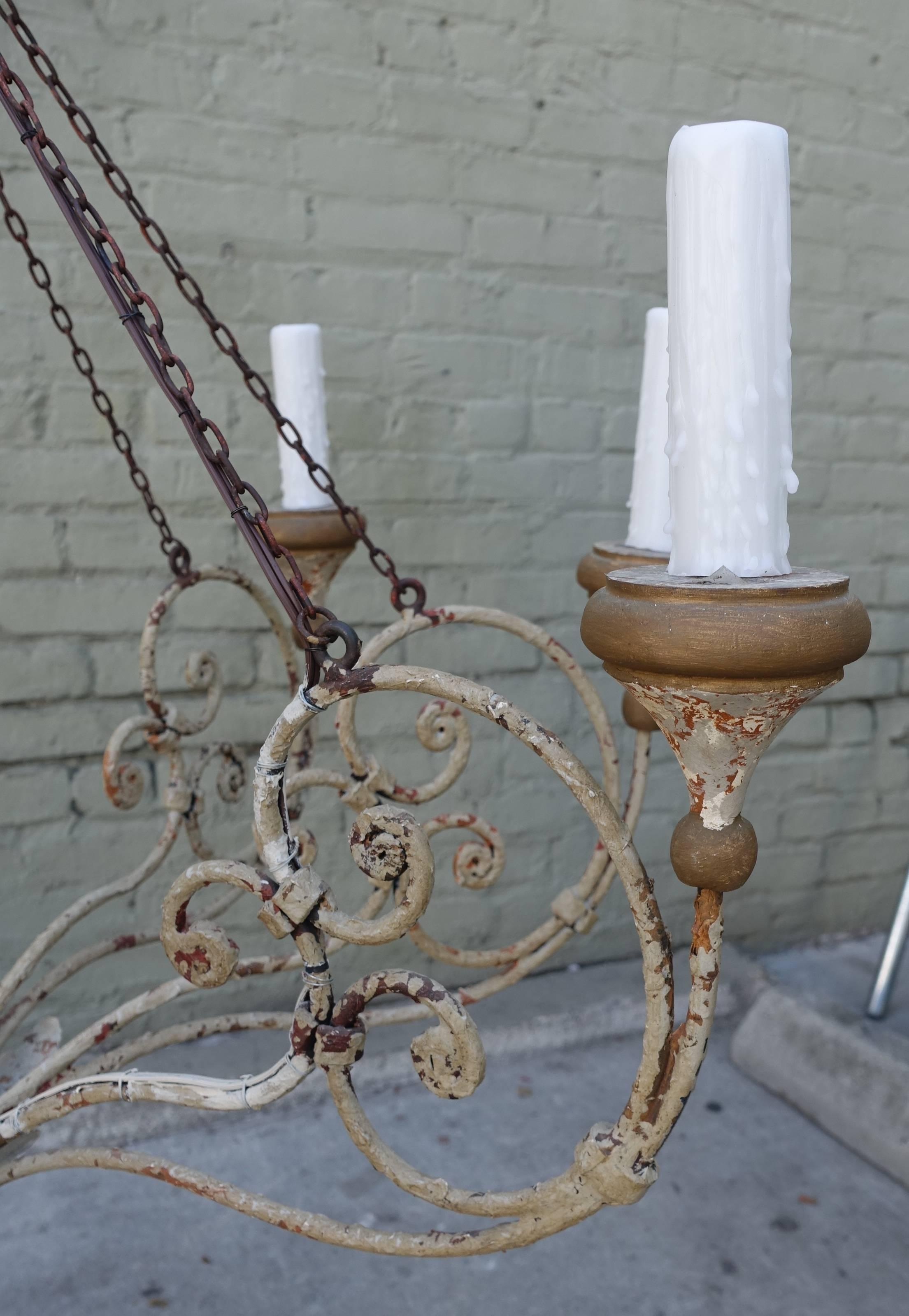 Eight arm Rivoli chandelier by Niermann weeks in painted iron and wood. Newly rewired and ready to install with chain and canopy.