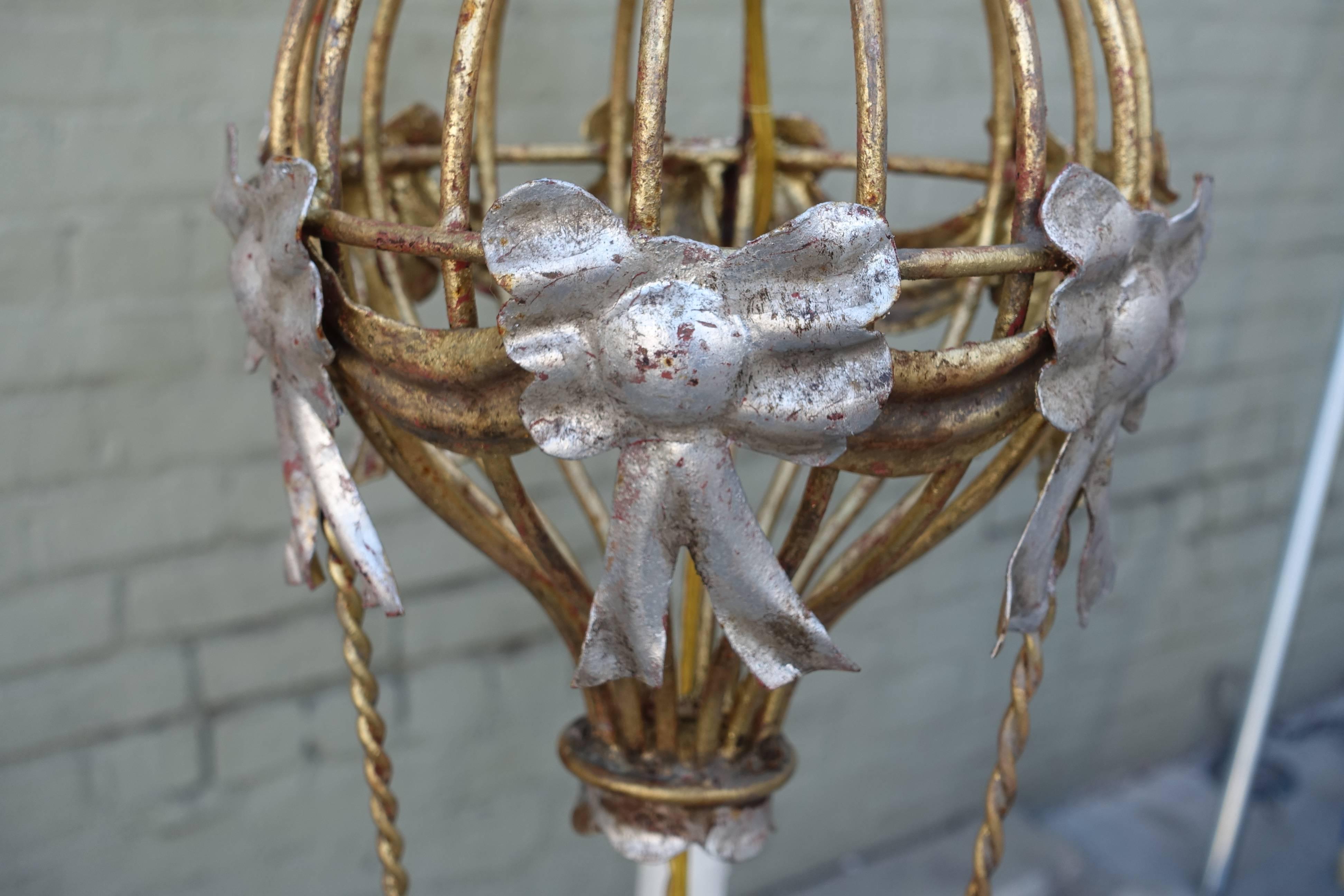 Gold and silver gilt metal four-light balloon chandelier with drip wax candle covers. Newly wired with chain and canopy included.