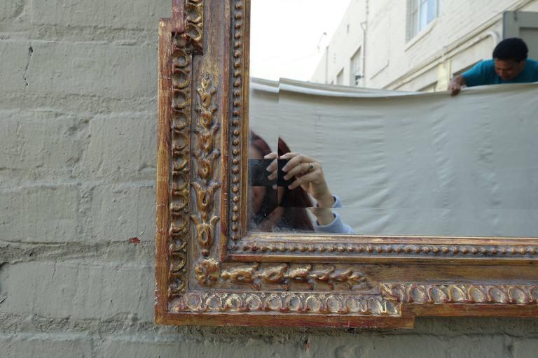 Italian Carved Giltwood Mirror with Bevel In Distressed Condition In Los Angeles, CA