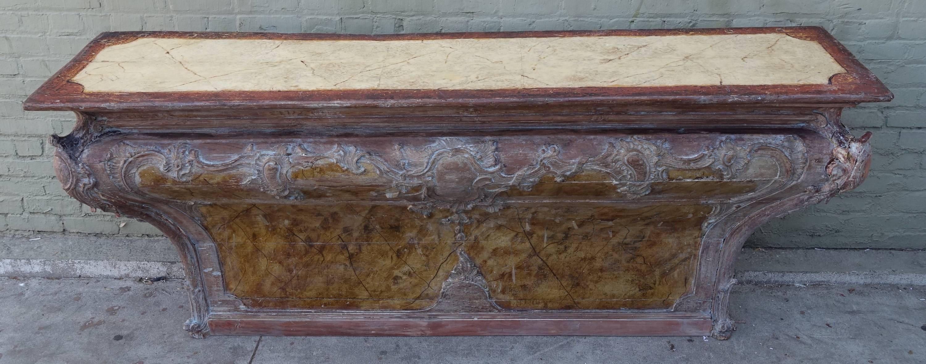 18th century Italian carved wood painted altar table with faux marble top.