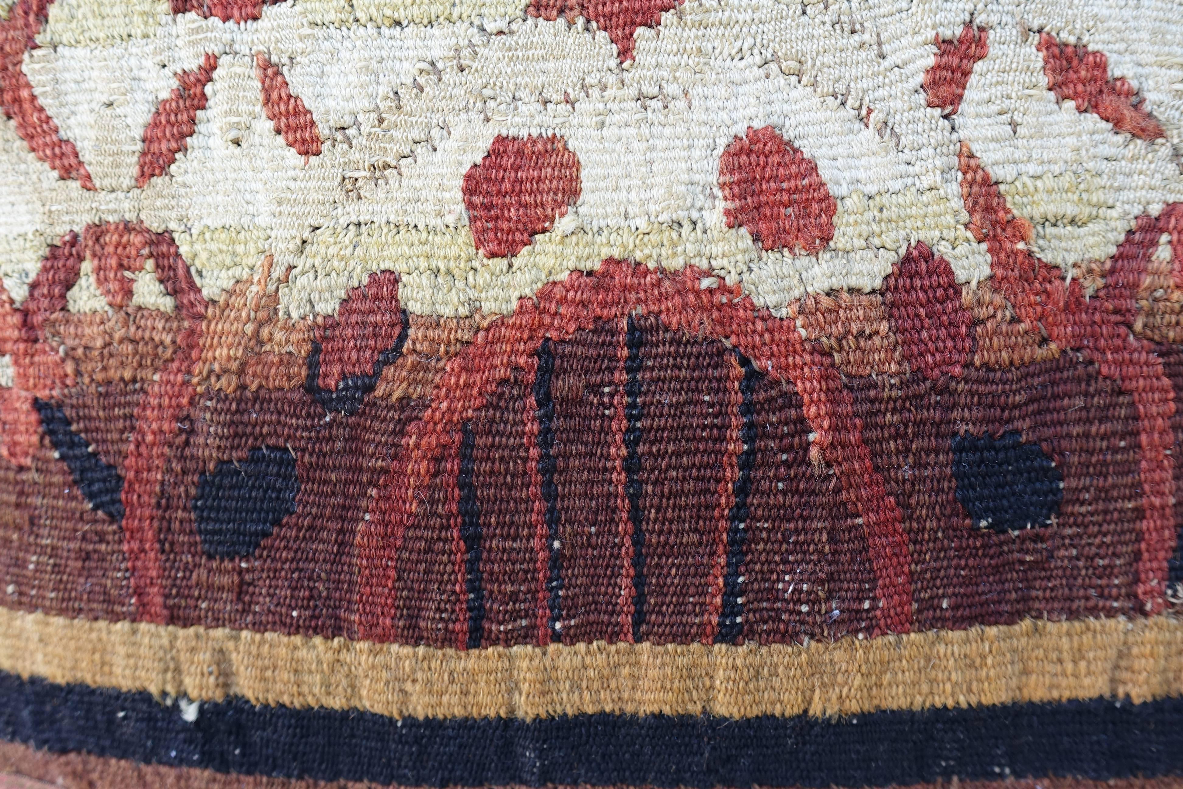 One custom designed pillow made with 18th century rust/cream/gold and brown tapestry fragments combined with rust colored linen, antique metallic tape and multicolored tassel fringe at sides.