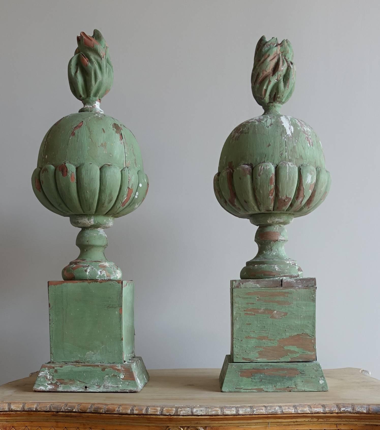 Pair of Italian painted carved wood flamed finials.