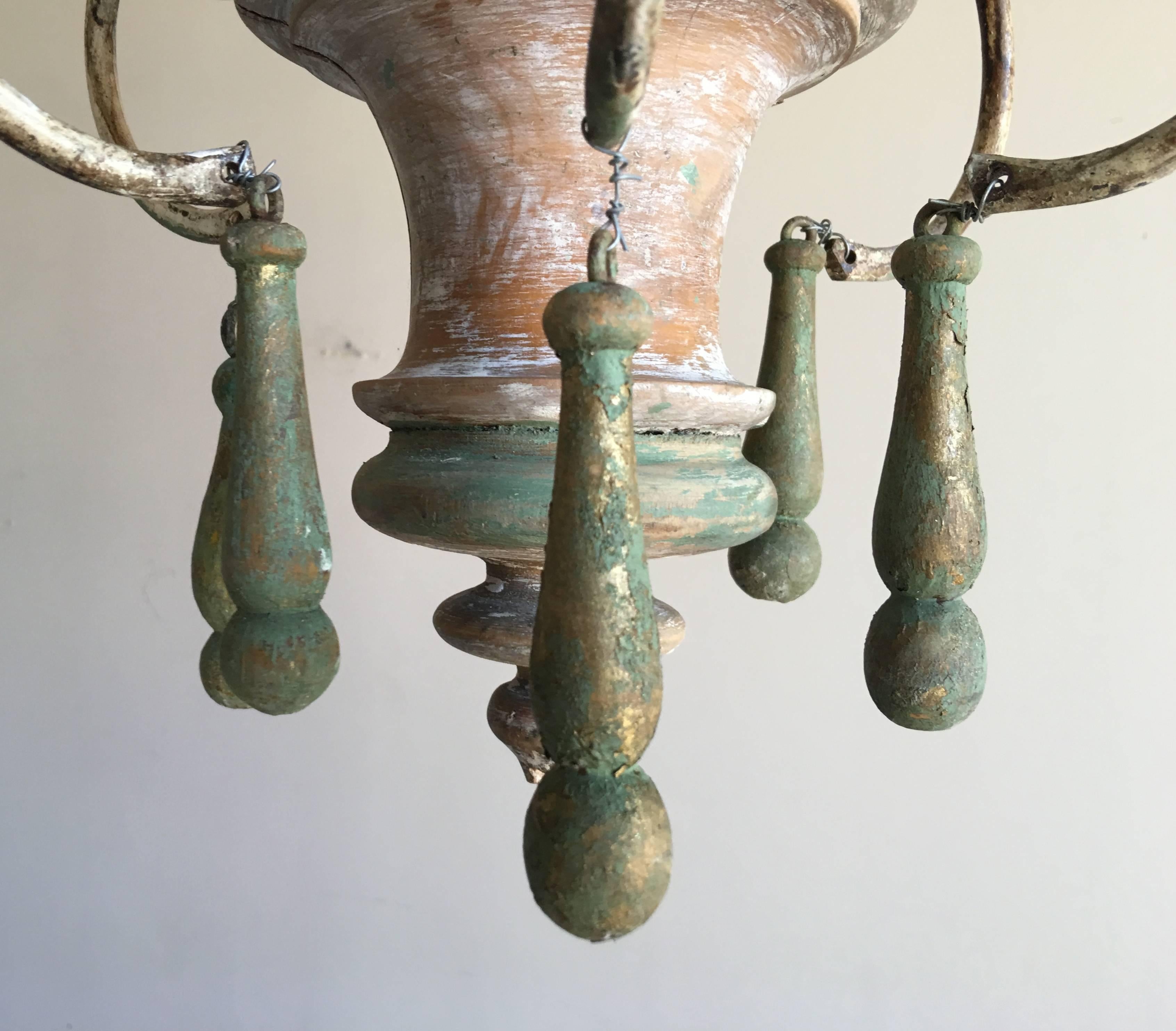 Six-light wood painted and iron chandelier with wooden bobeches. Newly wired with chain and canopy included,.