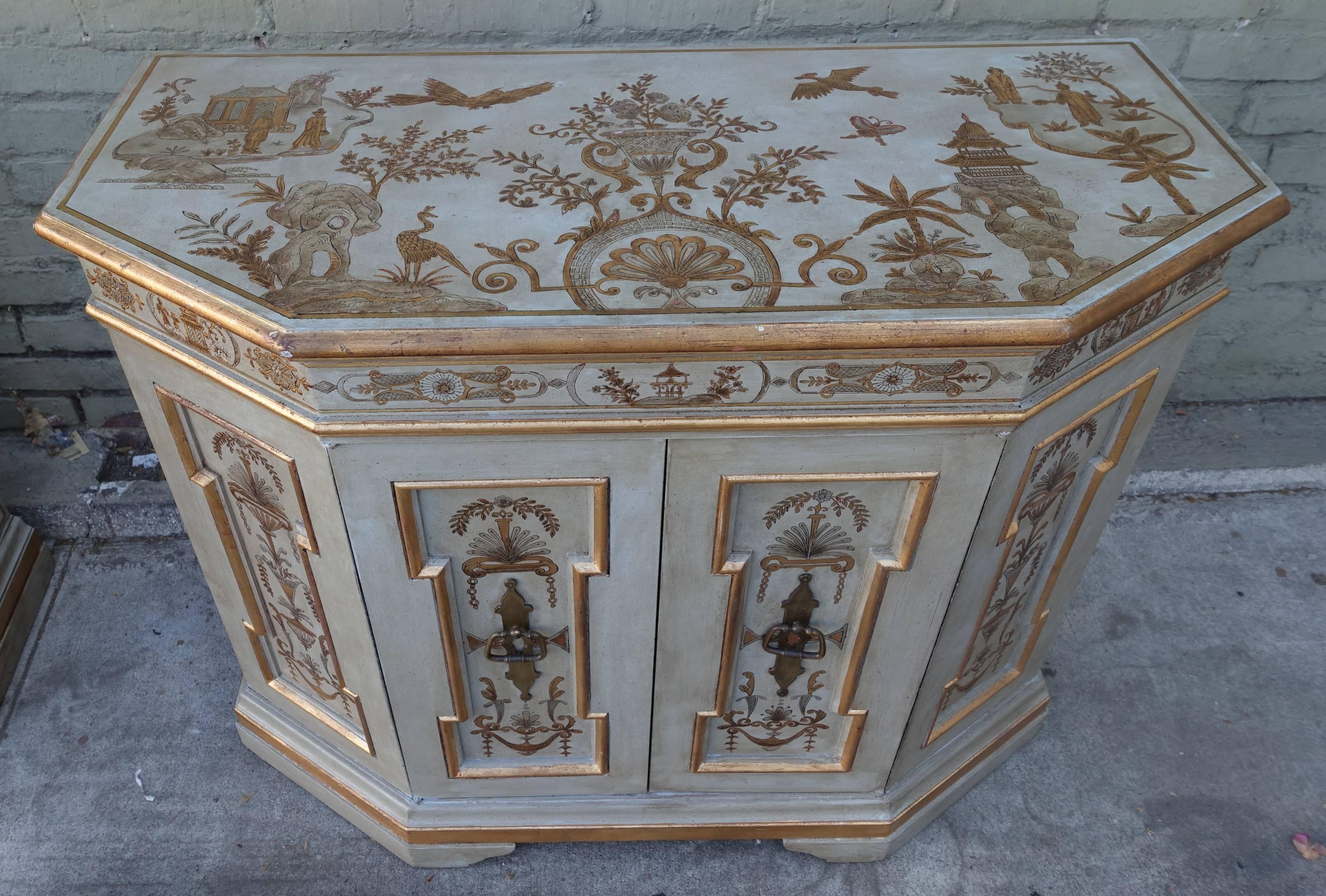 Pair of soft grey painted two-door cabinets in silver and gold raised fine chinoiserie design.
