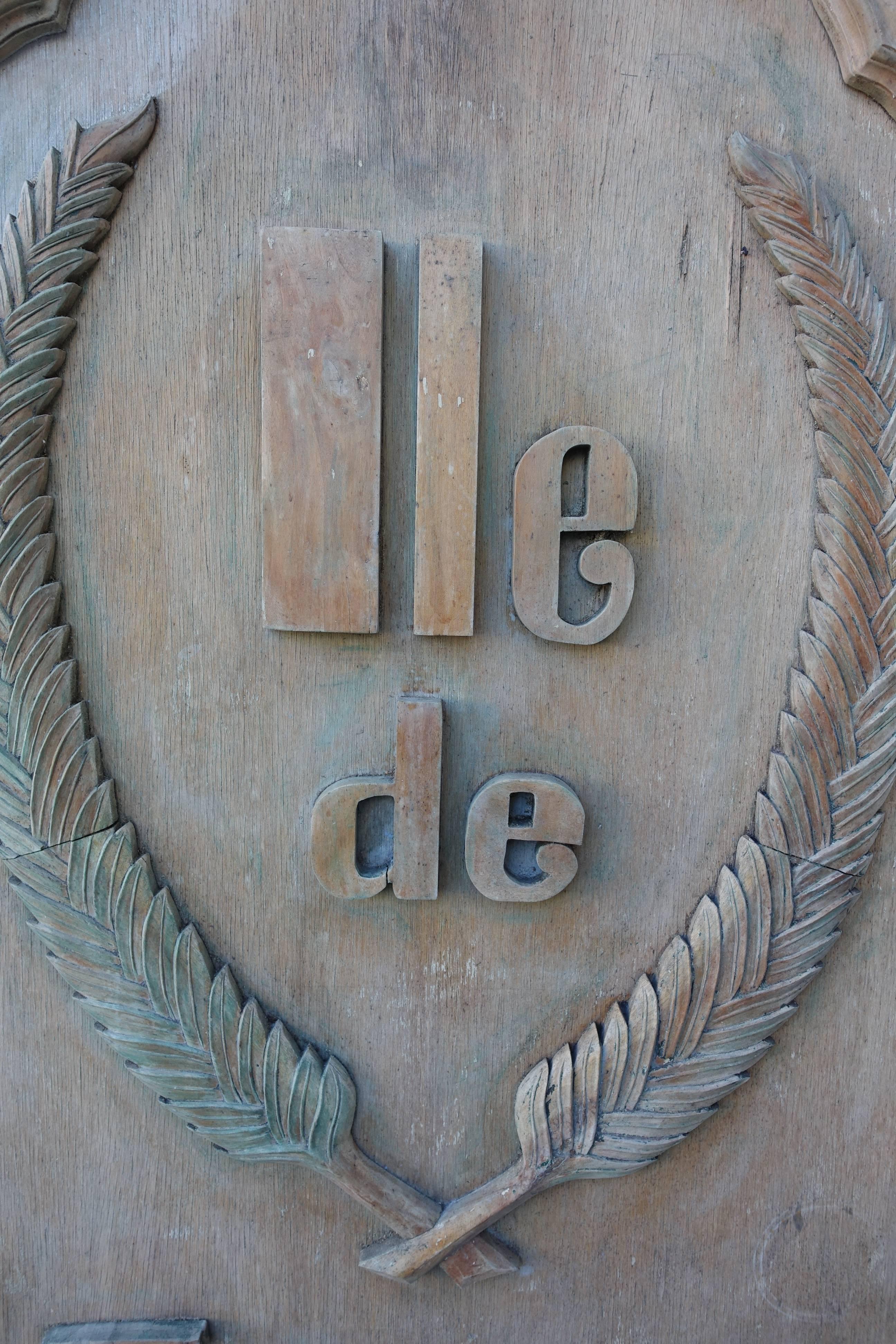 Monumental scaled carved wood "lle de France" sign.