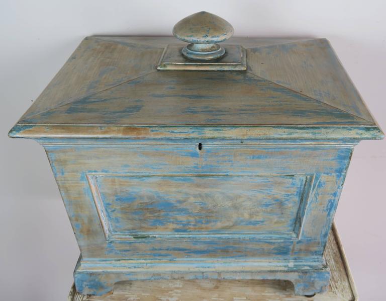19th century English painted box on original four casters. This box was used as a wine cooler.