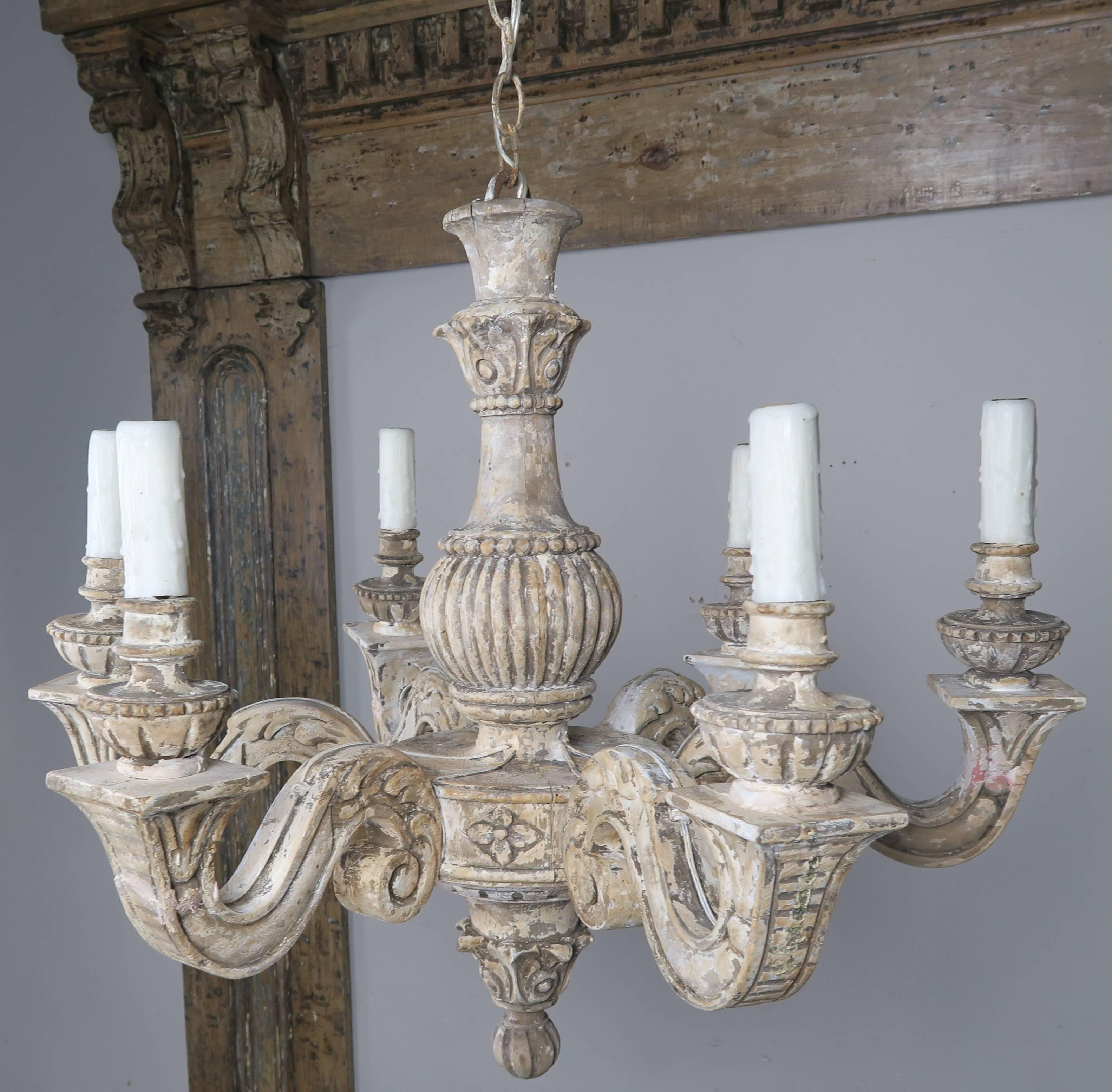 Six-light carved wood painted Italian chandelier newly rewired with drip wax candle covers. Includes chain and canopy.