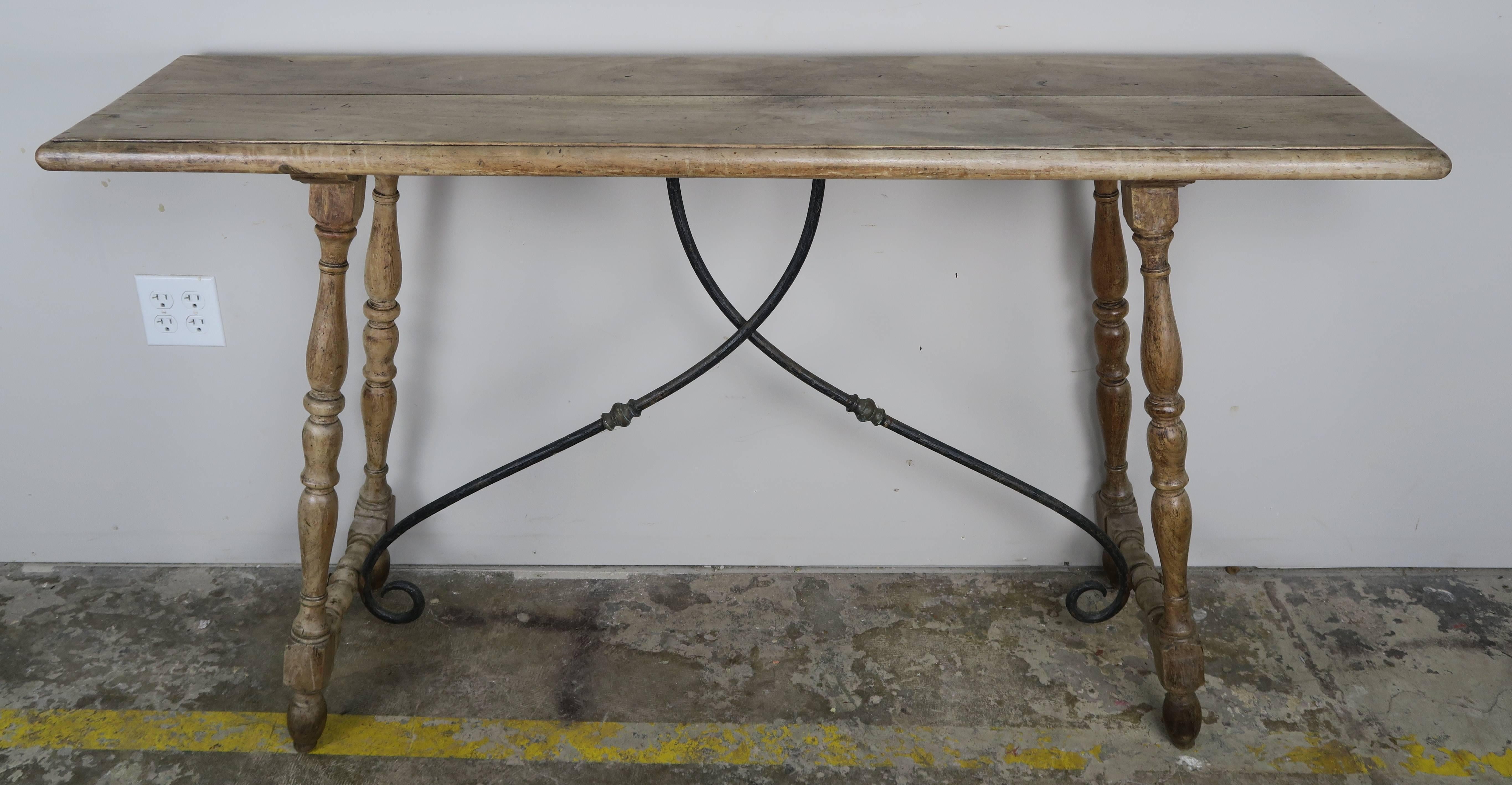 Spanish walnut table with iron stretcher. Great scale for a sofa back table.