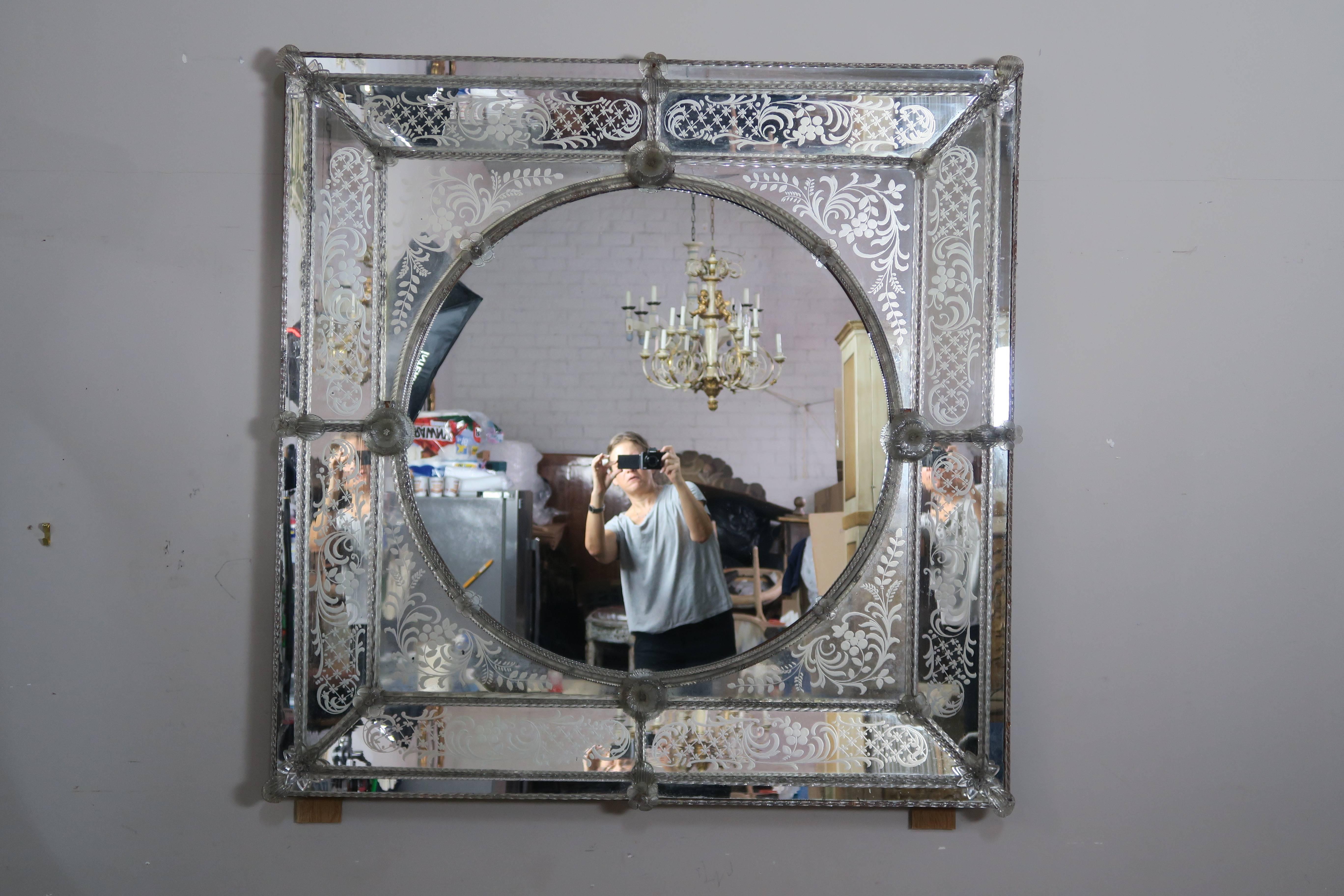 Monumental Italian etched Venetian mirror with handblown glass flowers throughout.