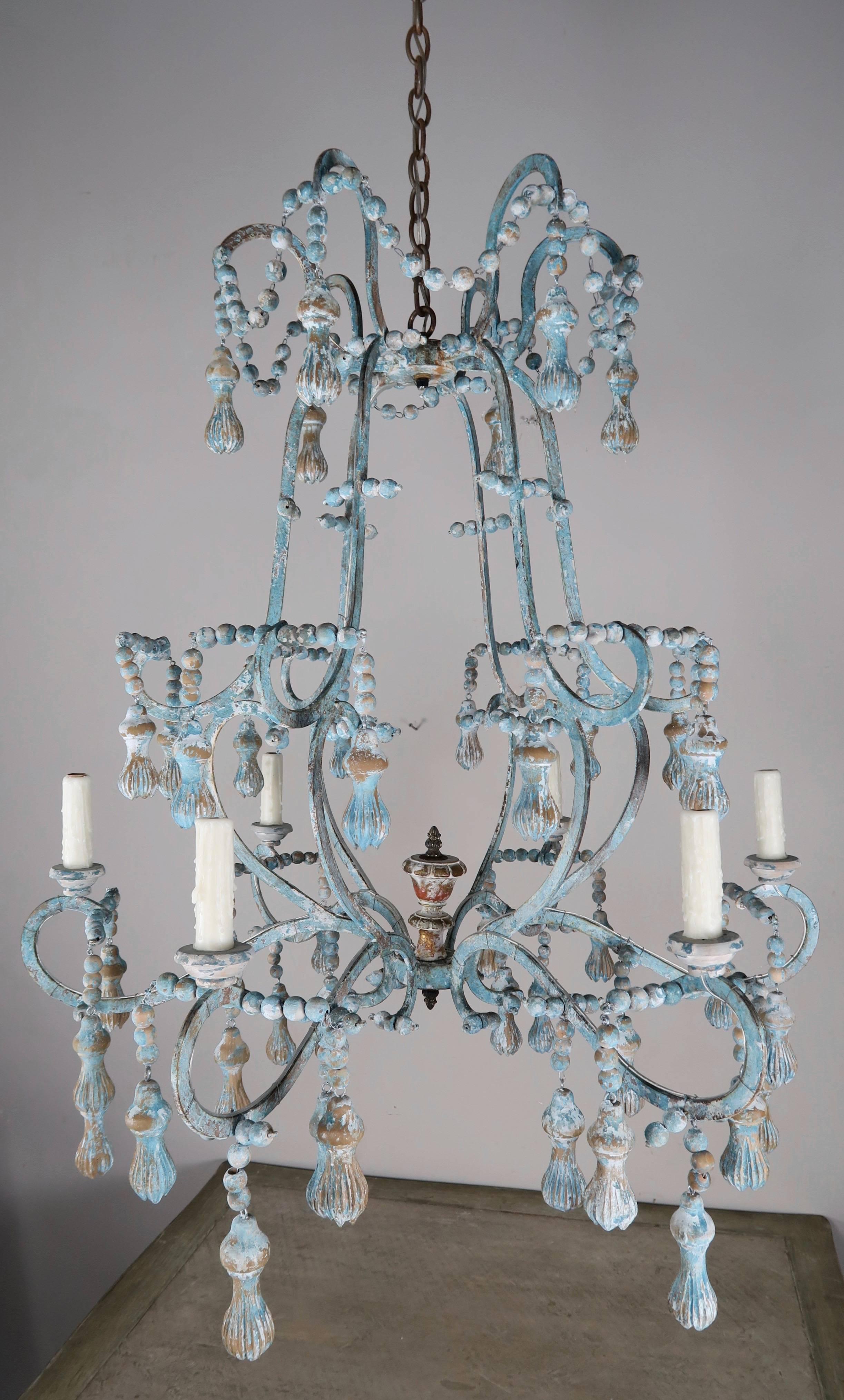 Carved Italian Wood Beaded and Iron Painted Chandelier In Distressed Condition In Los Angeles, CA