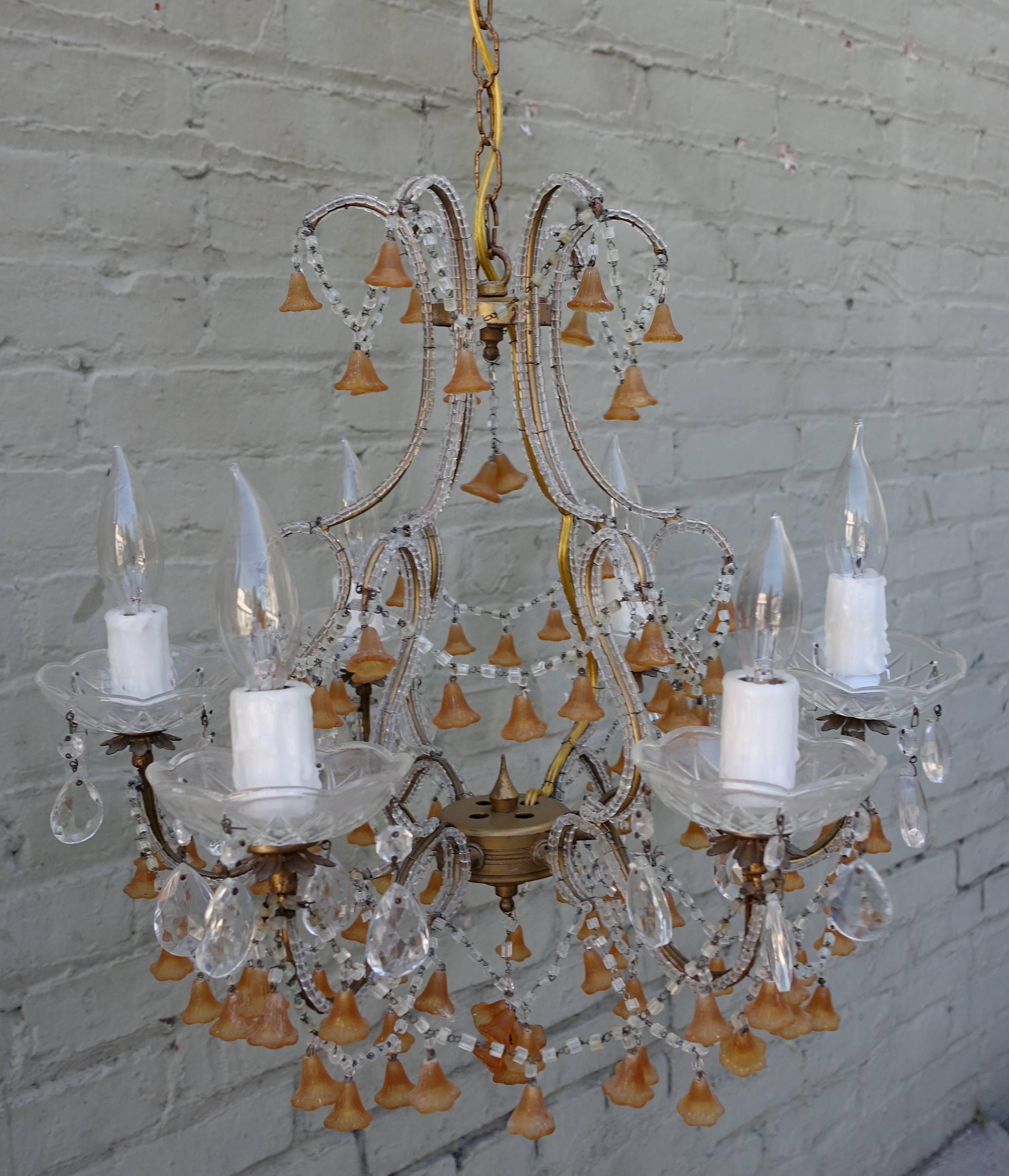 Six-light beaded crystal chandelier with amber Murano handblown hanging bells. Six clear bobeches hold drip wax candleholders. The fixture has been newly wired and includes chain and canopy.