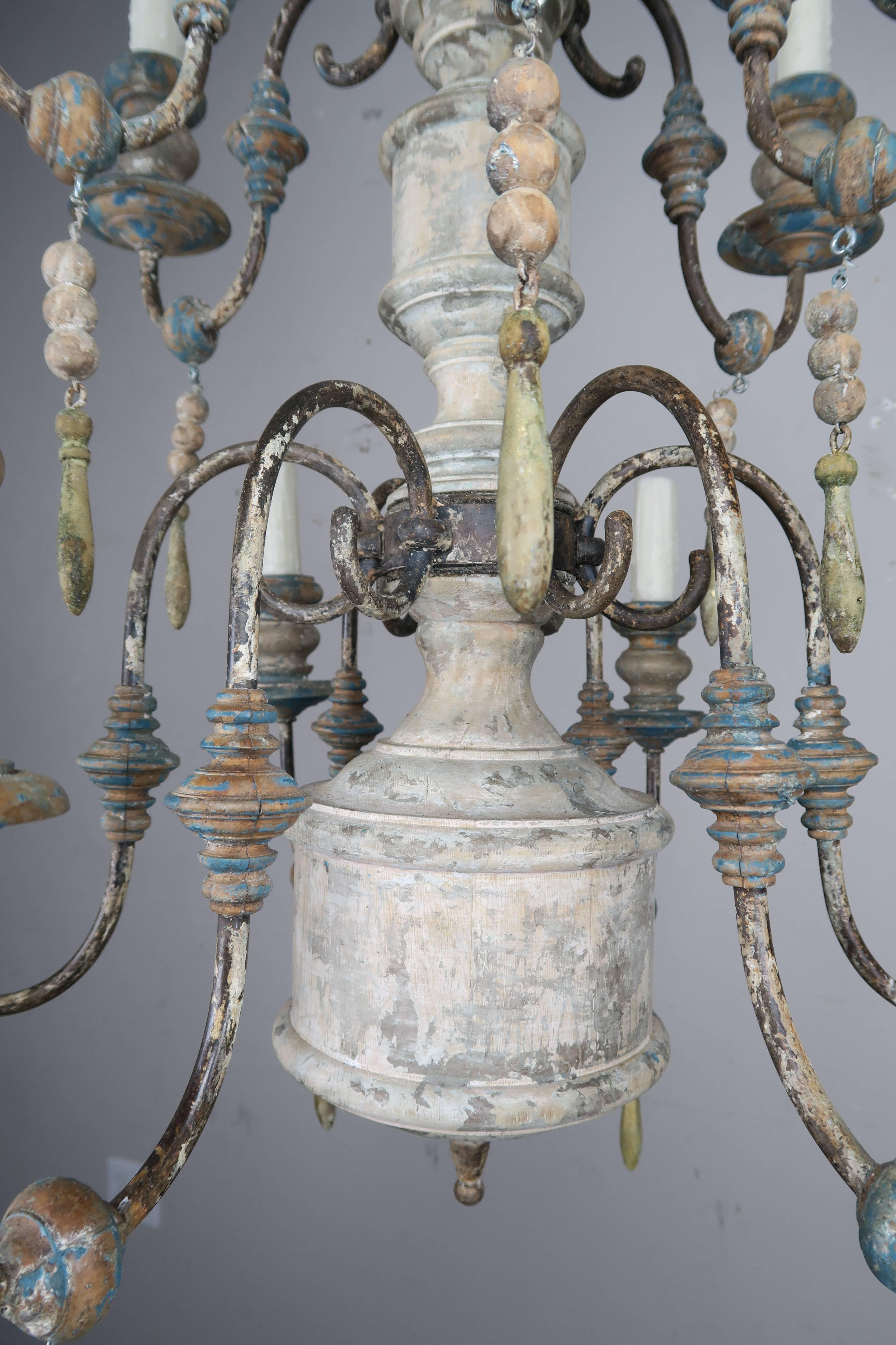 Pair of Twelve-Light Wood and Iron Painted Chandeliers In Distressed Condition In Los Angeles, CA