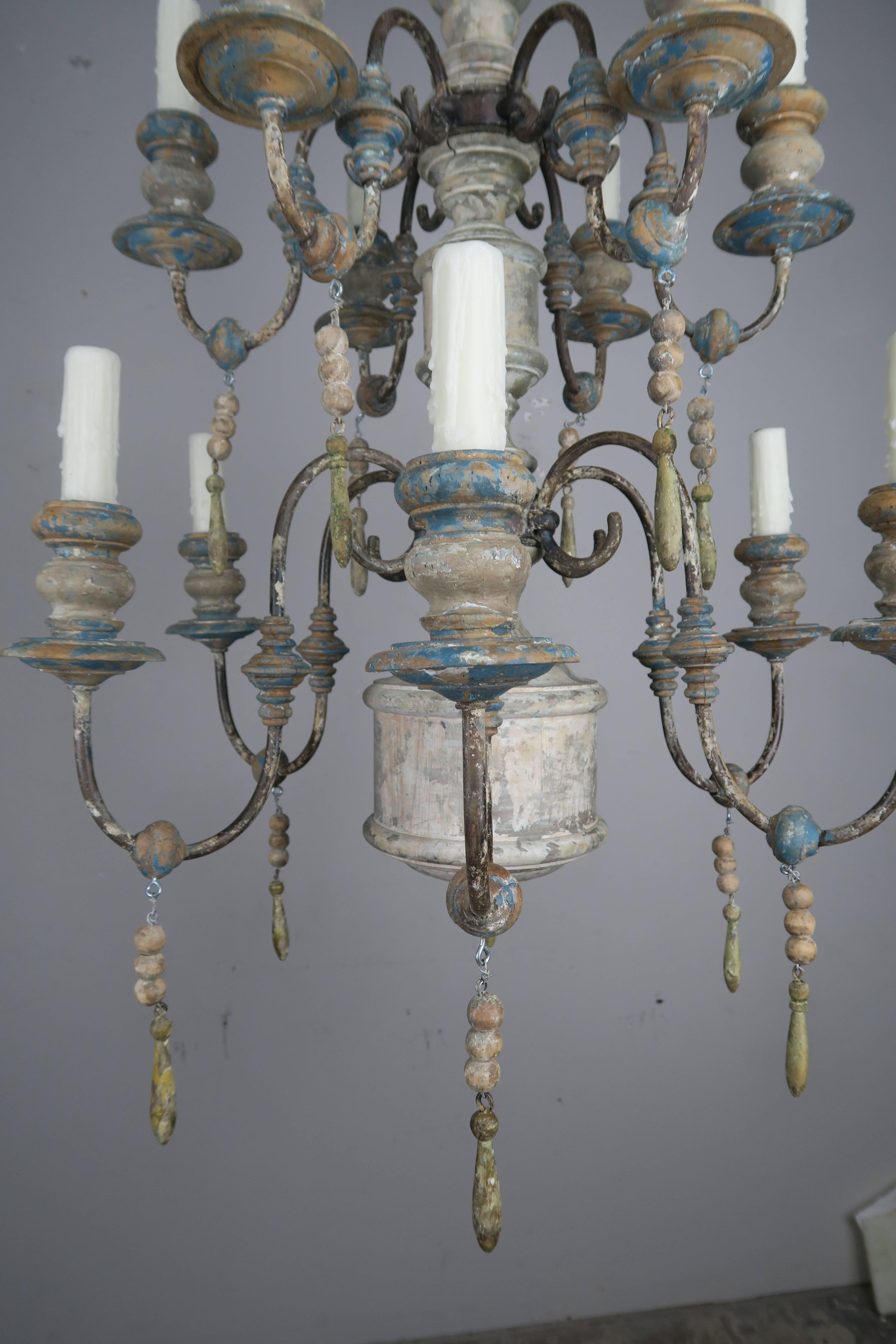 Pair of Twelve-Light Wood and Iron Painted Chandeliers 1